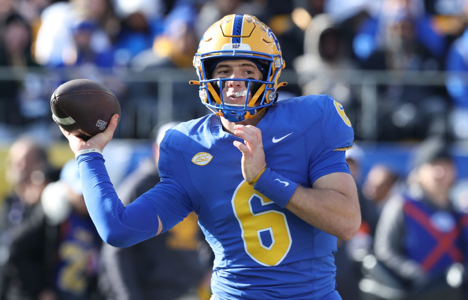 Pittsburgh Panthers quarterback Mason Heintschel (6) passes against the Miami Hurricanes during the first quarter at Acrisure Stadium.