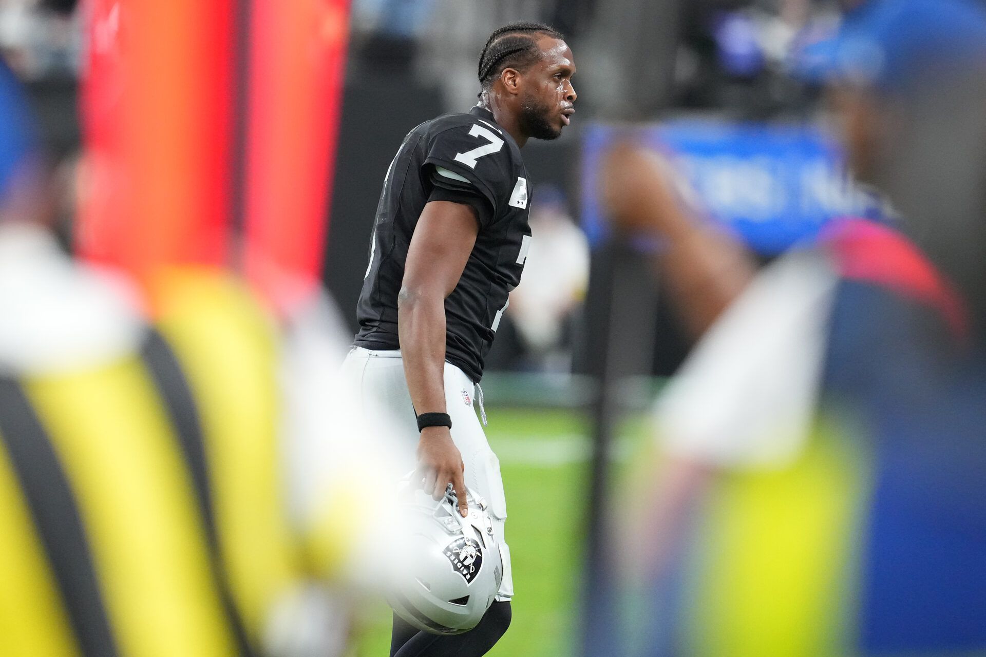 Las Vegas Raiders quarterback Geno Smith (7) shouts toward is bench after failing to convert against the Cleveland Browns during the third quarter at Allegiant Stadium.