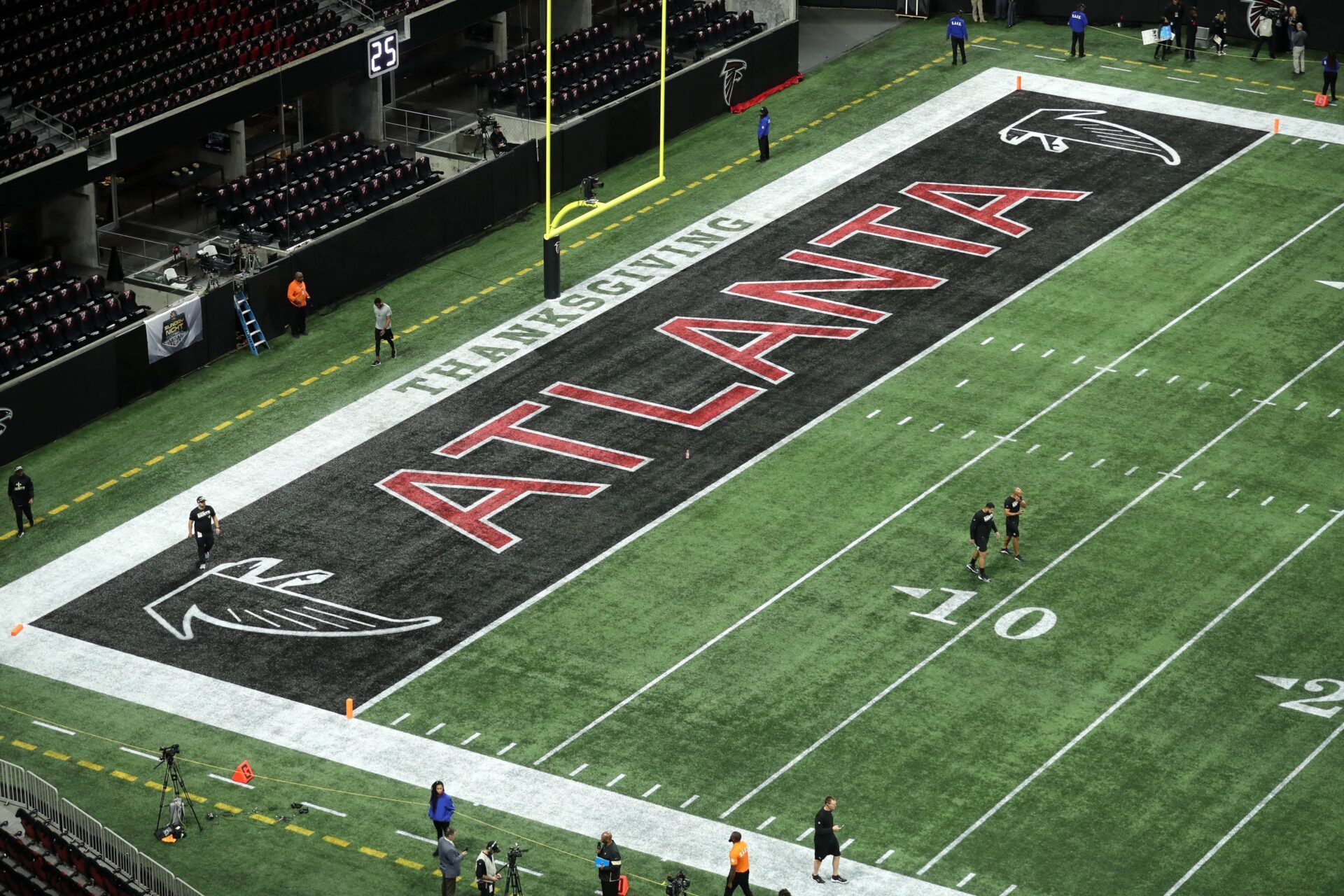 The Atlanta Falcons logo is shown in an end zone before the game between the New Orleans Saints and the Atlanta Falcons at Mercedes-Benz Stadium.