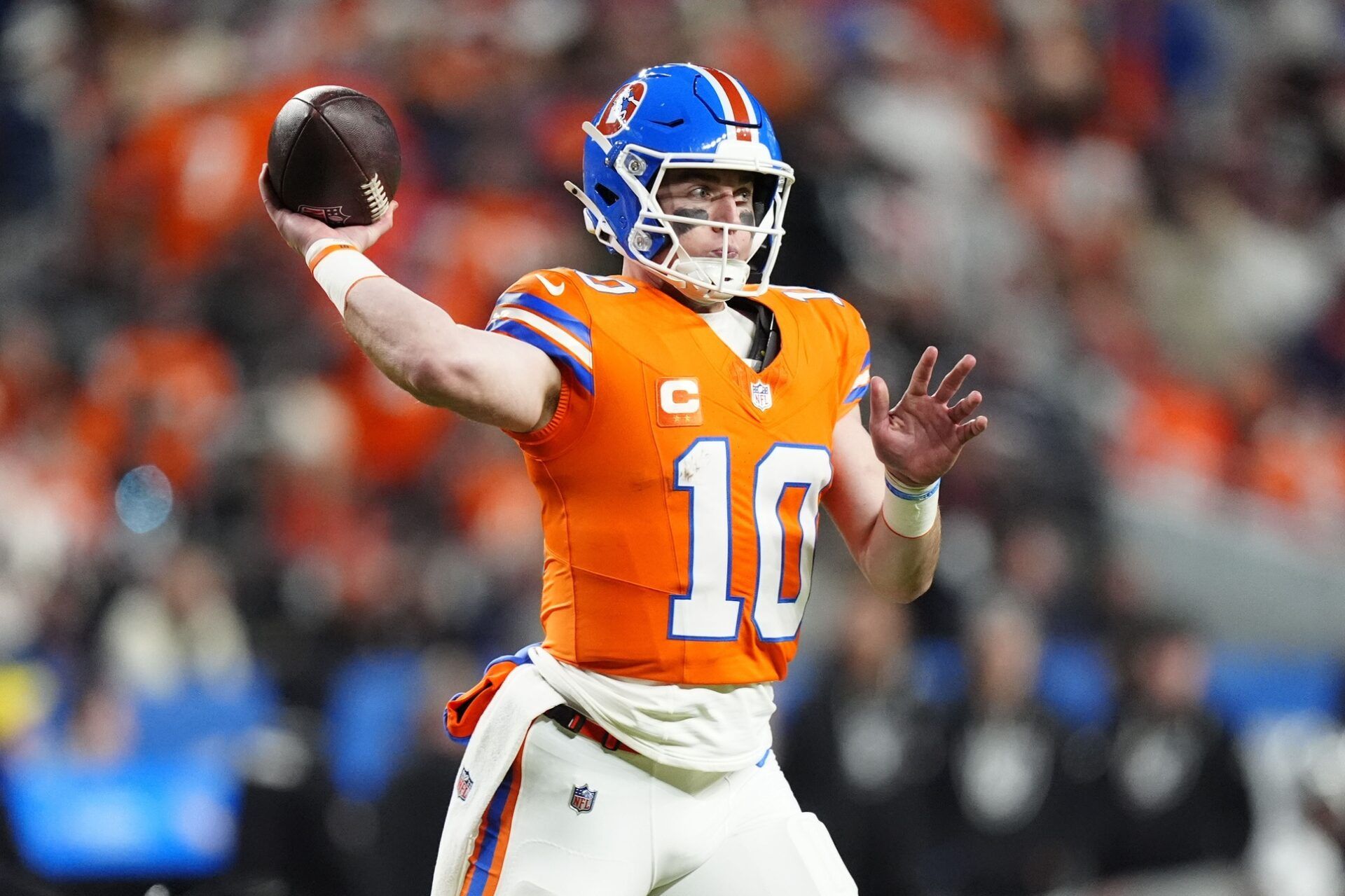 Denver Broncos quarterback Bo Nix (10) drops back to pass against the Las Vegas Raiders during the first half at Empower Field at Mile High.