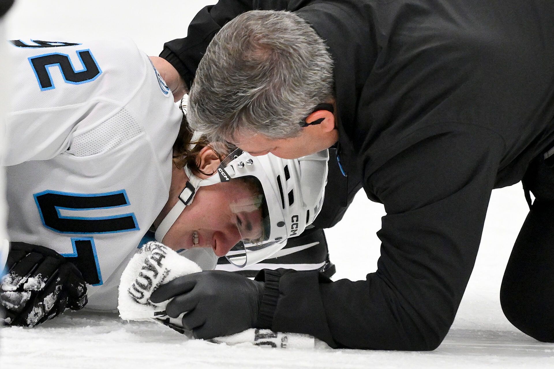 Utah Mammoth center Logan Cooley (92) is checked on by a trainer after he was kneed by St. Louis Blues right wing Alexey Toropchenko (not pictured) during the third period at Enterprise Center.