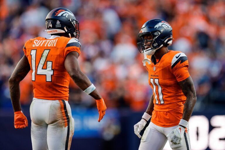 Denver Broncos wide receiver Troy Franklin (11) reacts with wide receiver Courtland Sutton (14) after a play in the fourth quarter against the New York Giants at Empower Field at Mile High.