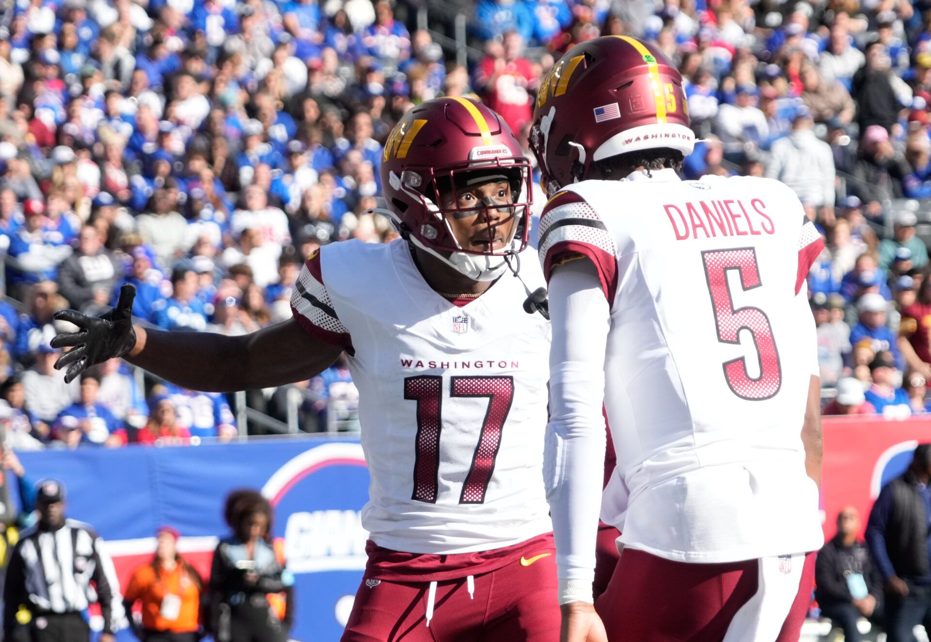 Washington Commanders wide receiver Terry McLaurin (17) after a 1st quarter towchdown reception from quarterback Jayden Daniels (5) against the New York Giants at MetLife Stadium.