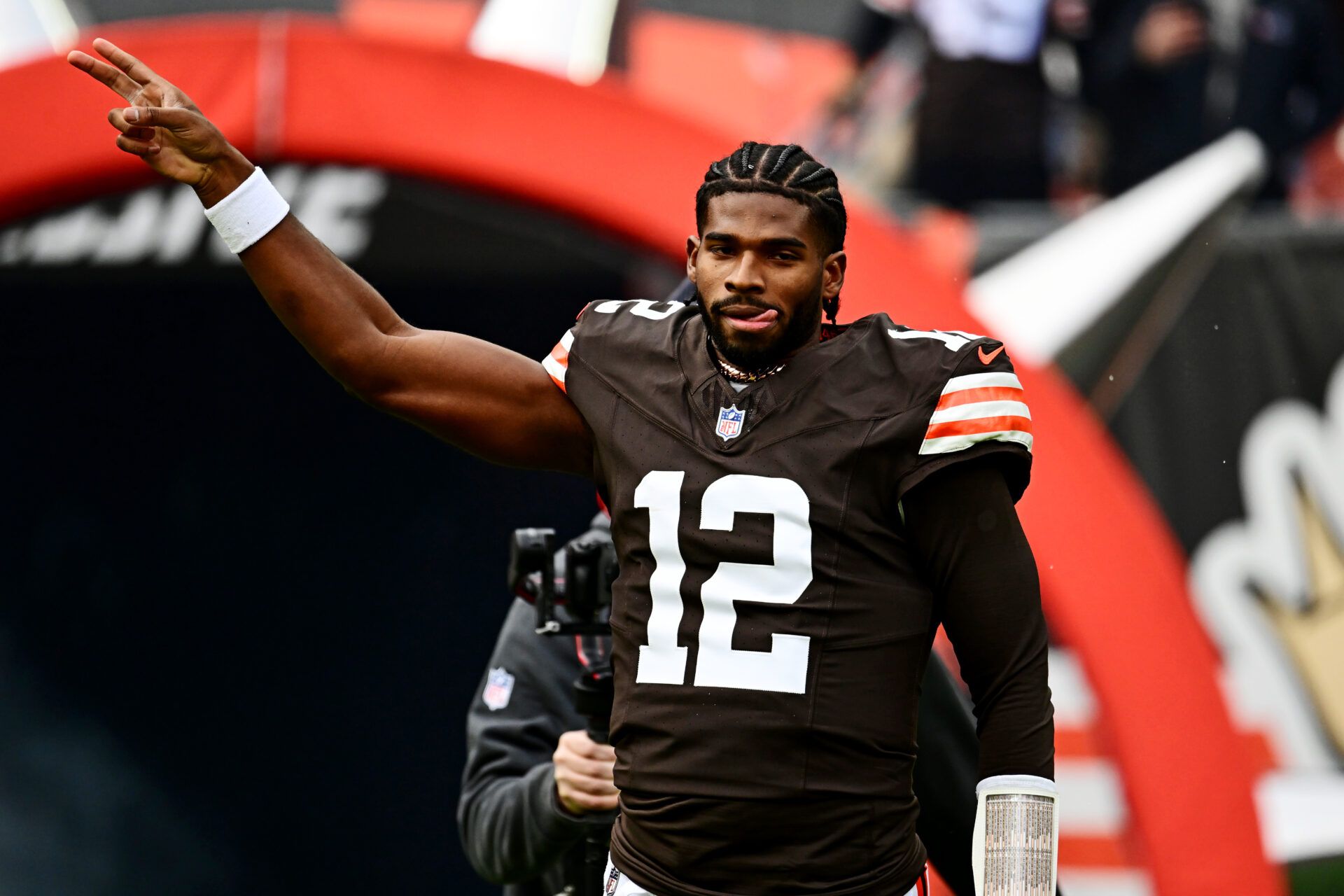 Cleveland Browns quarterback Shedeur Sanders (12) runs on the field before the game against the San Francisco 49ers at Huntington Bank Field.