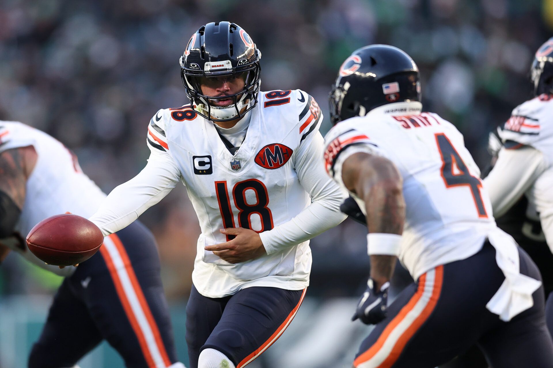 Chicago Bears quarterback Caleb Williams (18) hands off the ball to Chicago Bears running back D'Andre Swift (4) against the Philadelphia Eagles during the second quarter of the game at Lincoln Financial Field.