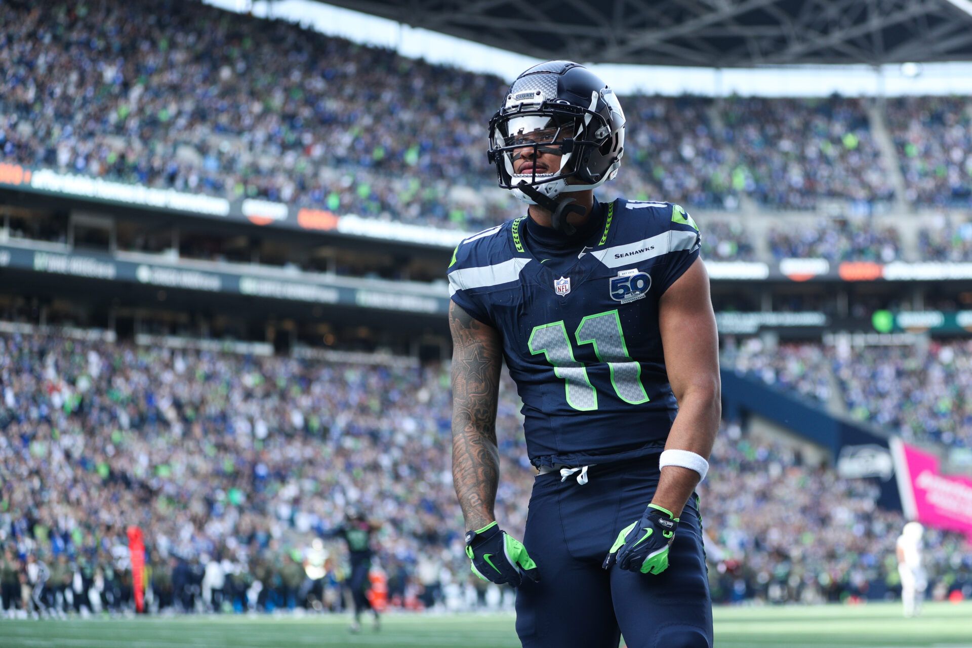 Seattle Seahawks wide receiver Jaxon Smith-Njigba (11) celebrates after scoring a touchdown during the first quarter against the Arizona Cardinals at Lumen Field.