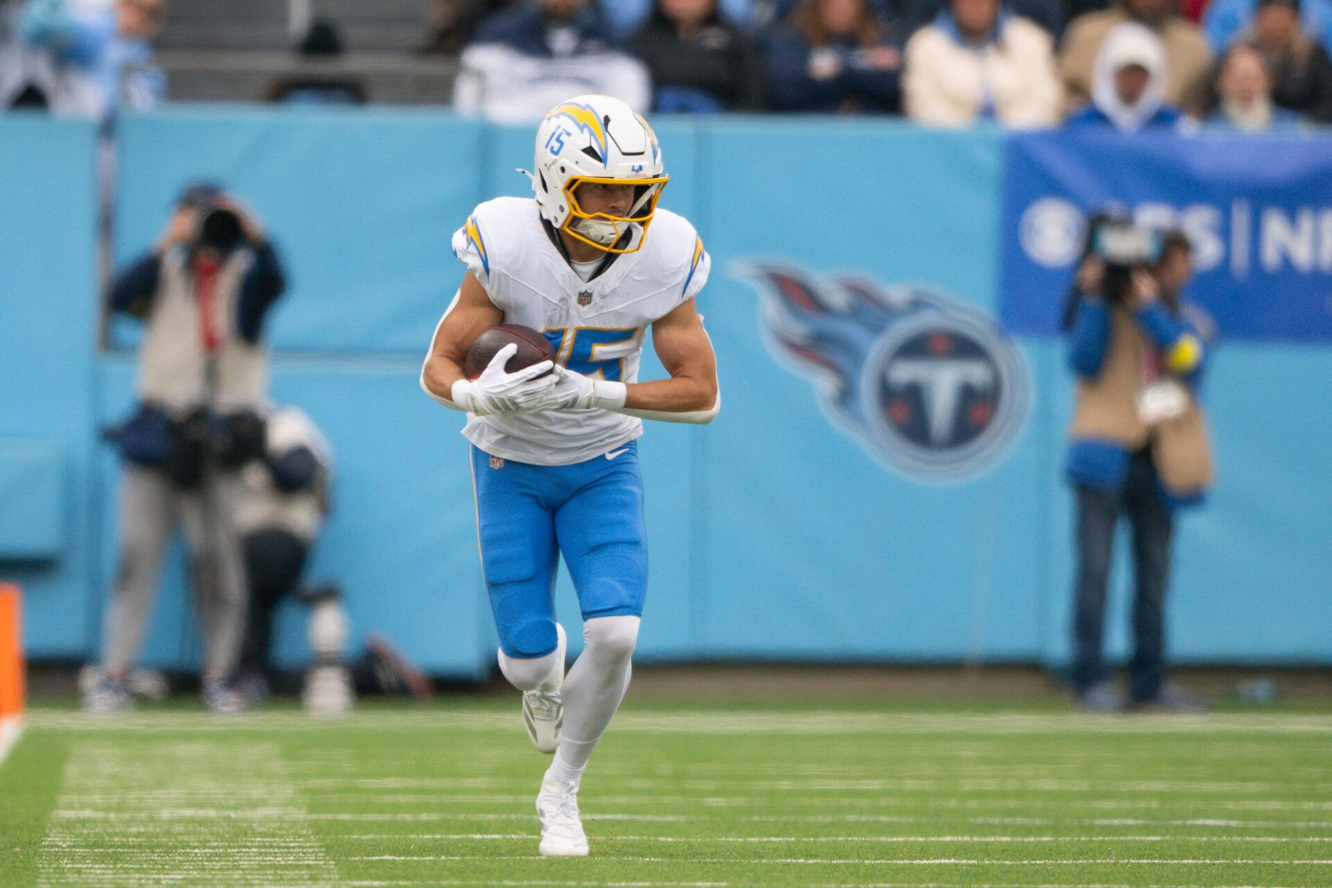 Los Angeles Chargers wide receiver Ladd McConkey (15) runs with the ball after a made catch against the Tennessee Titans during the first half at Nissan Stadium.