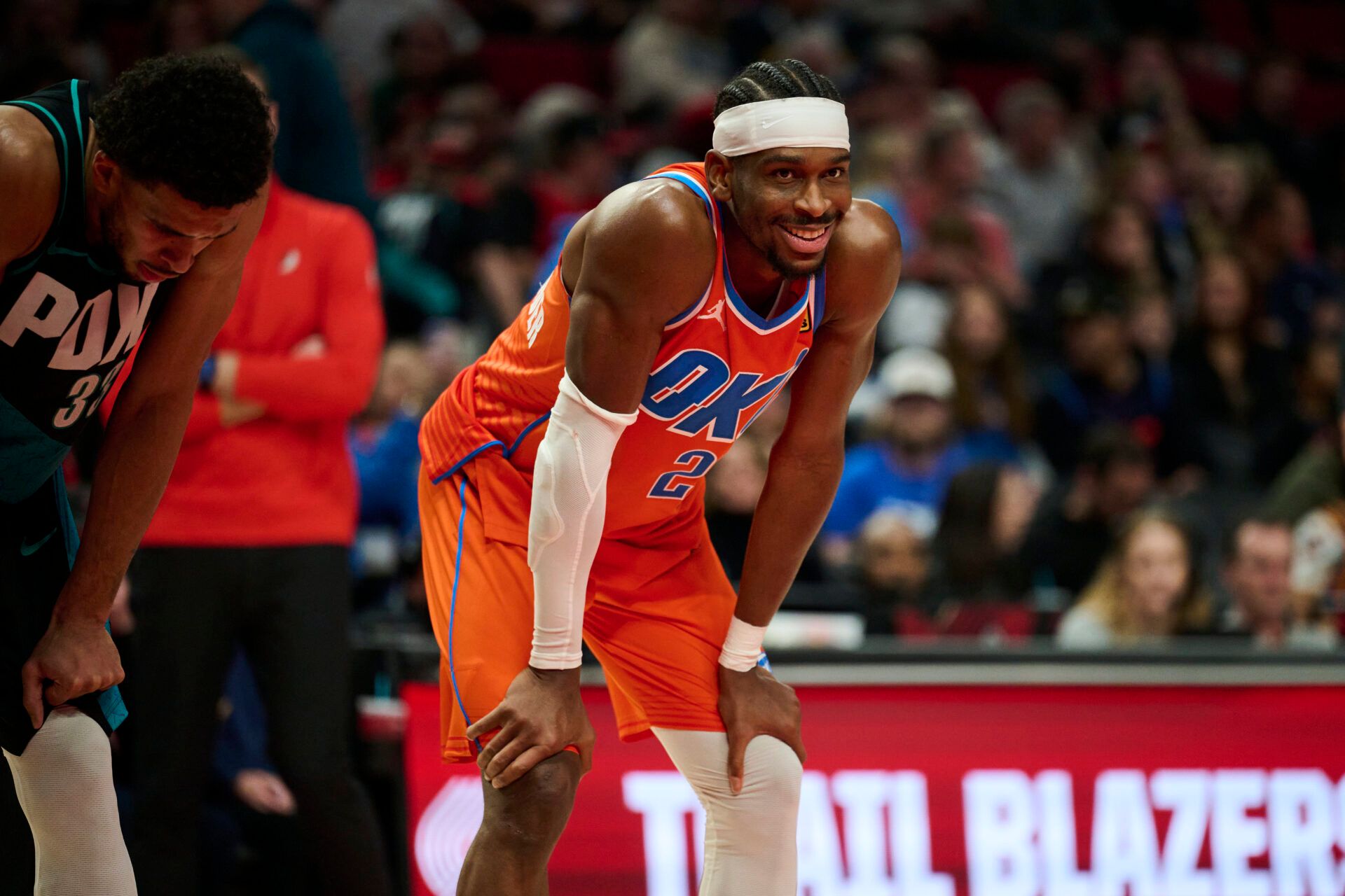 Oklahoma City Thunder guard Shai Gilgeous-Alexander (2) smiles at a fan during the second half in a game against the Portland Trail Blazers at Moda Center.