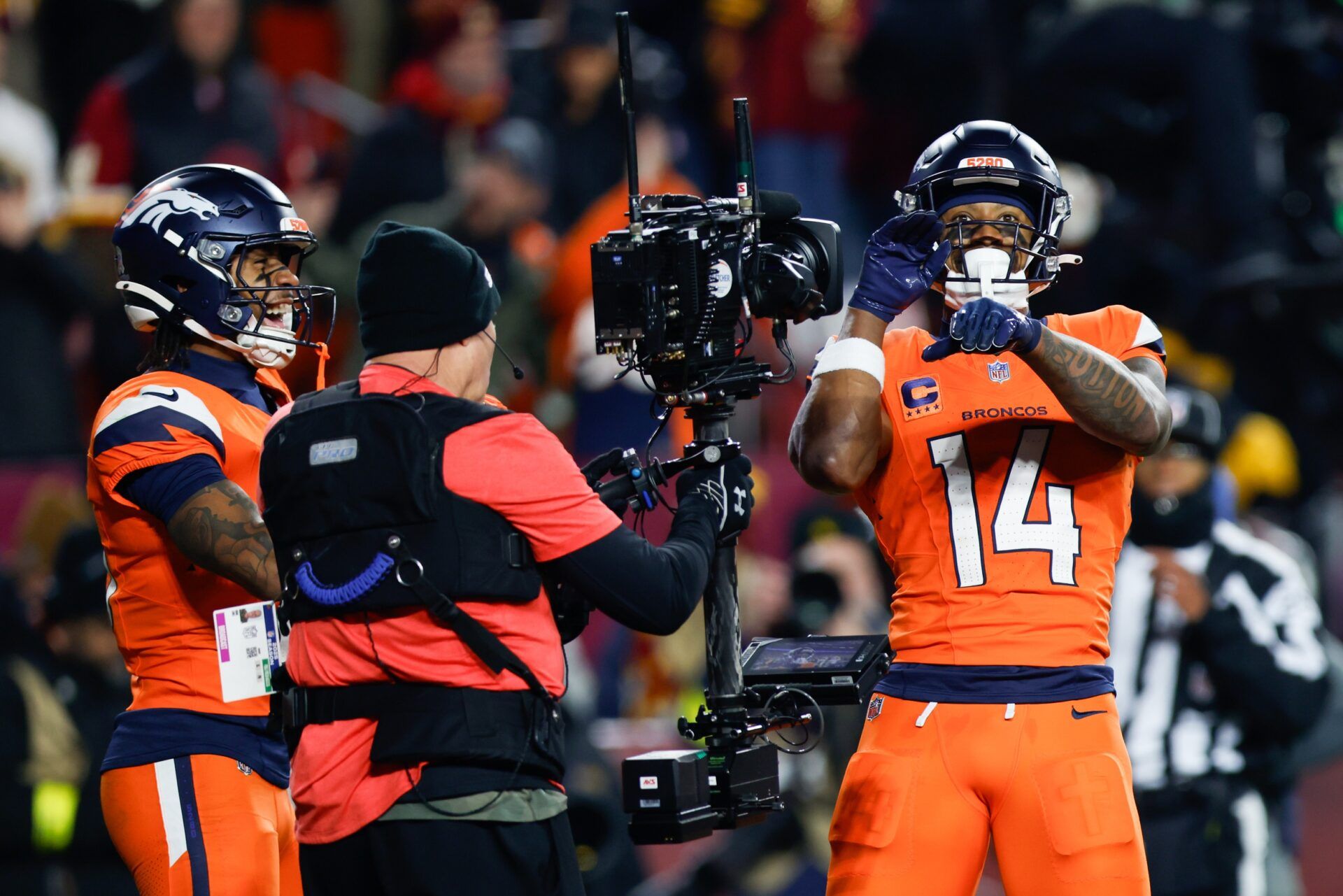 Denver Broncos wide receiver Courtland Sutton (14) celebrates after scoring a touchdown against the Washington Commanders in the second quarter of the game at Northwest Stadium.