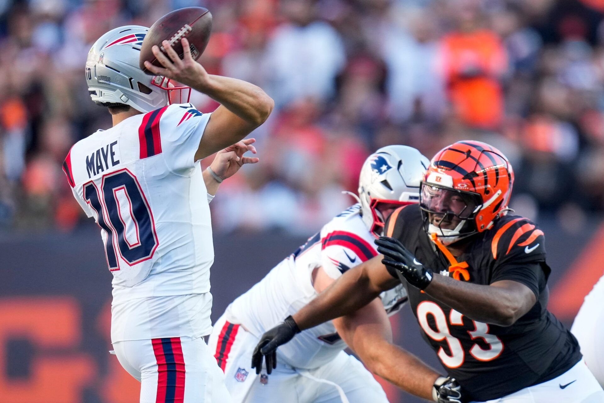 Cincinnati Bengals defensive tackle McKinnley Jackson (93) rushes New England Patriots quarterback Drake Maye (10) in the third quarter of the NFL Week 12 game between the Cincinnati Bengals and the New England Patriots at Paycor Stadium in downtown Cincinnati on Sunday, Nov. 23, 2025. The Bengals fall to 3-8 with a 26-20 loss at home.
