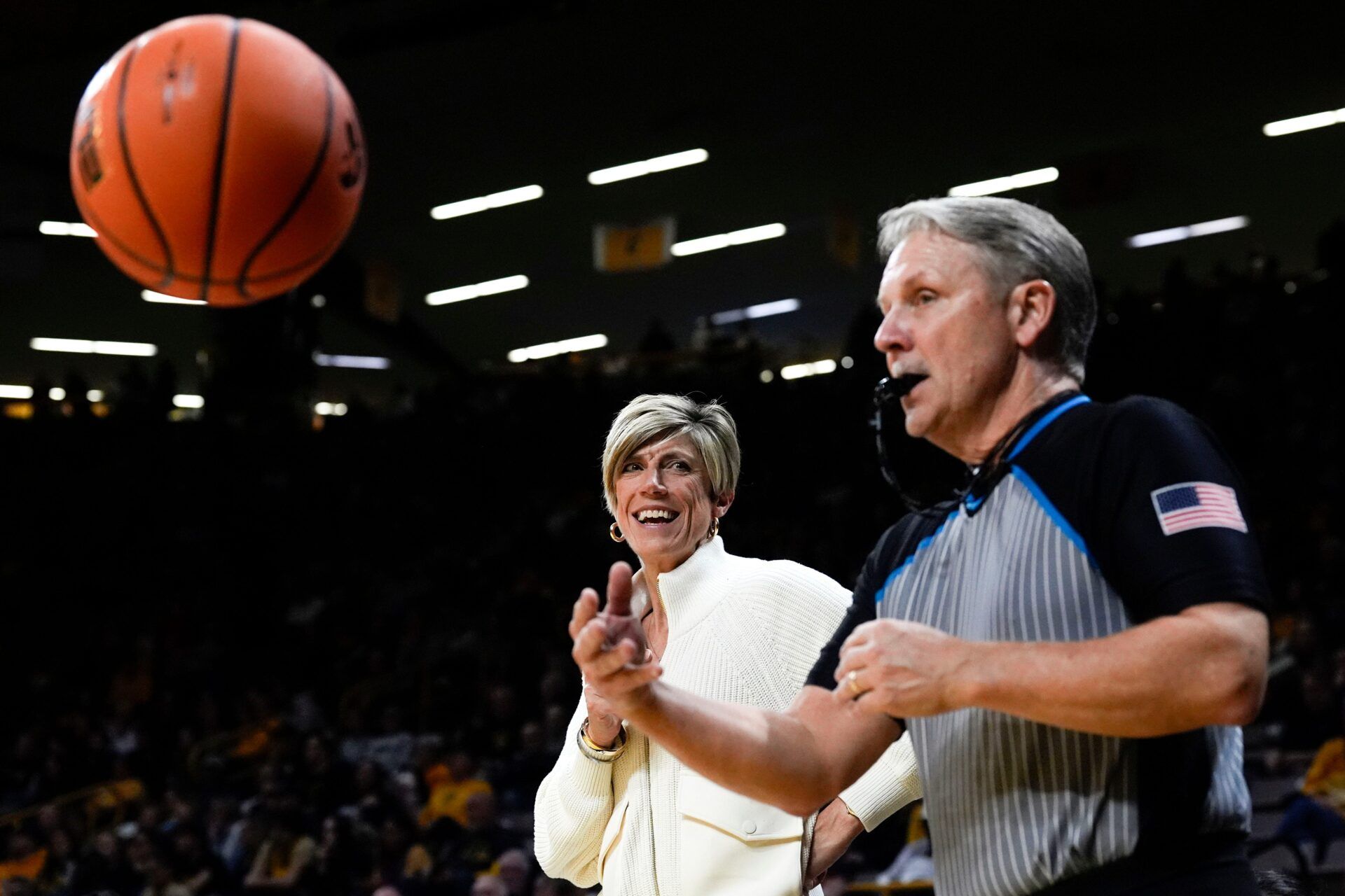 Iowa head coach Jan Jensen talks to a game official after a an out-of-bounds call was reviewed Nov. 26, 2025 at Carver-Hawkeye Arena in Iowa City, Iowa.