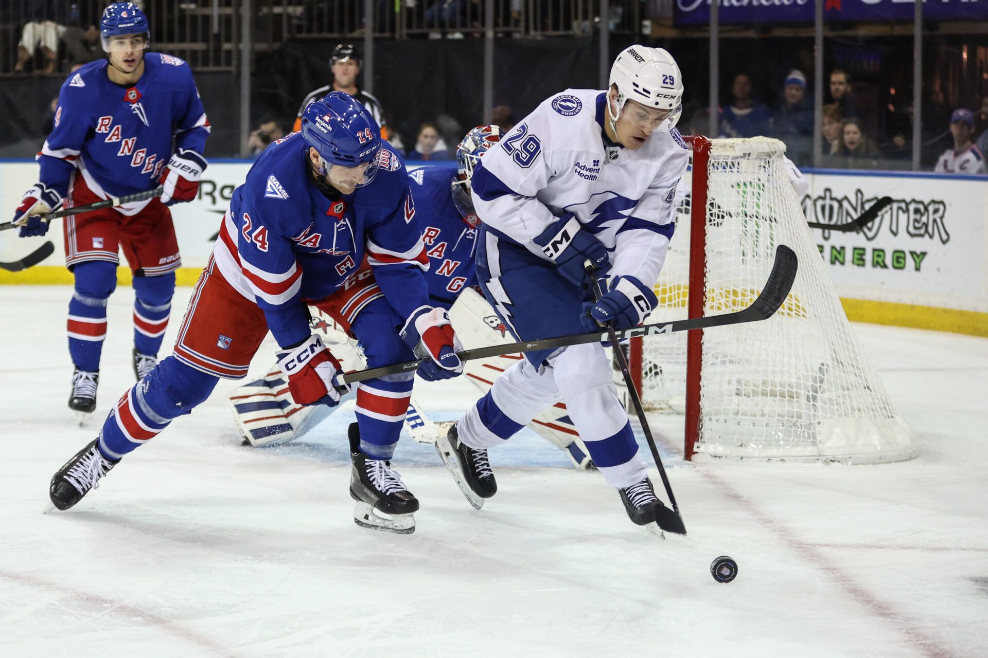 New York Rangers defenseman Carson Soucy (24) and Tampa Bay Lightning right wing Pontus Holmberg (29) battle for control of the puck at Madison Square Garden.