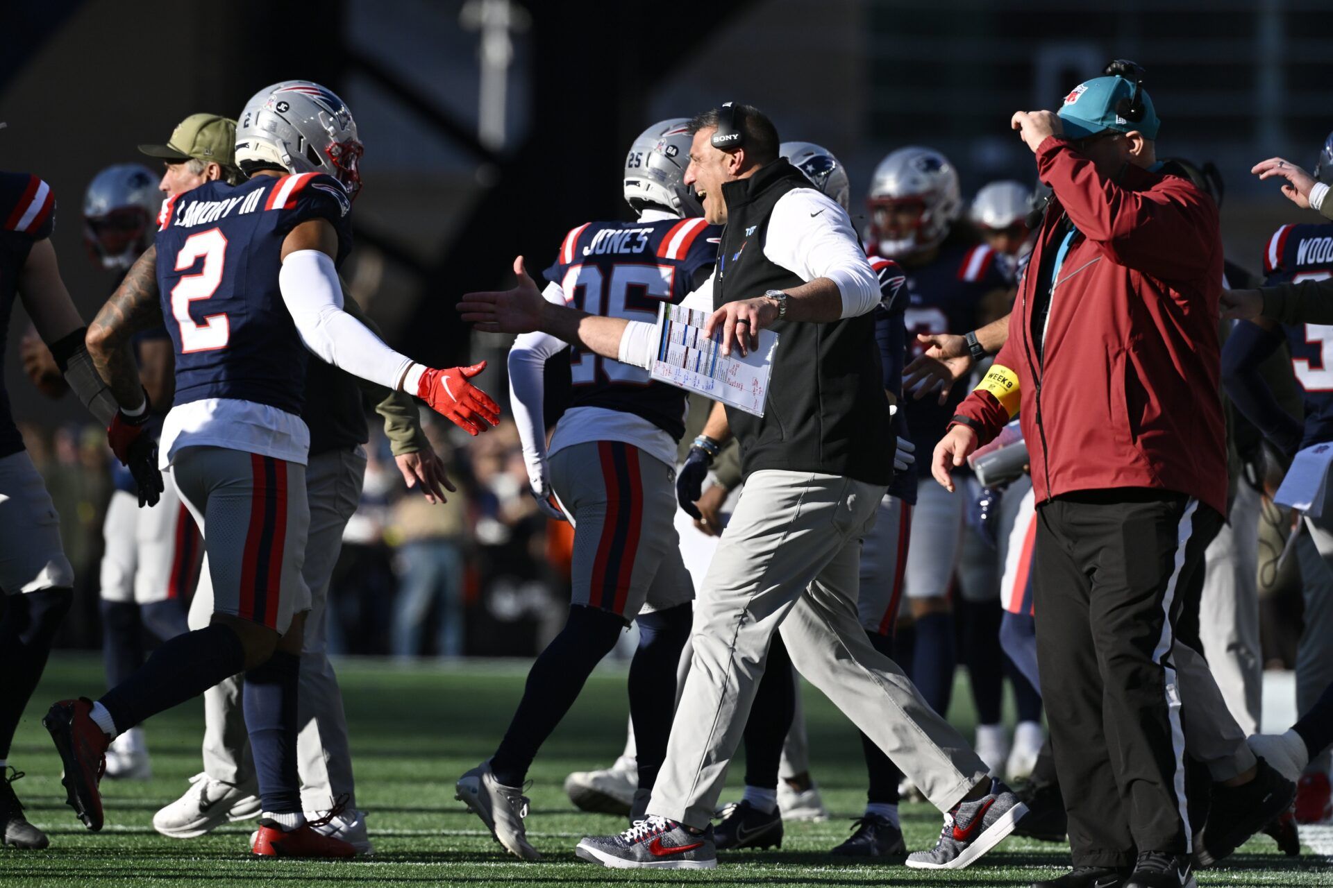 New England Patriots head coach Mike Vrabel high fives linebacker Harold Landry III (2) during the first half against the Atlanta Falcons at Gillette Stadium.