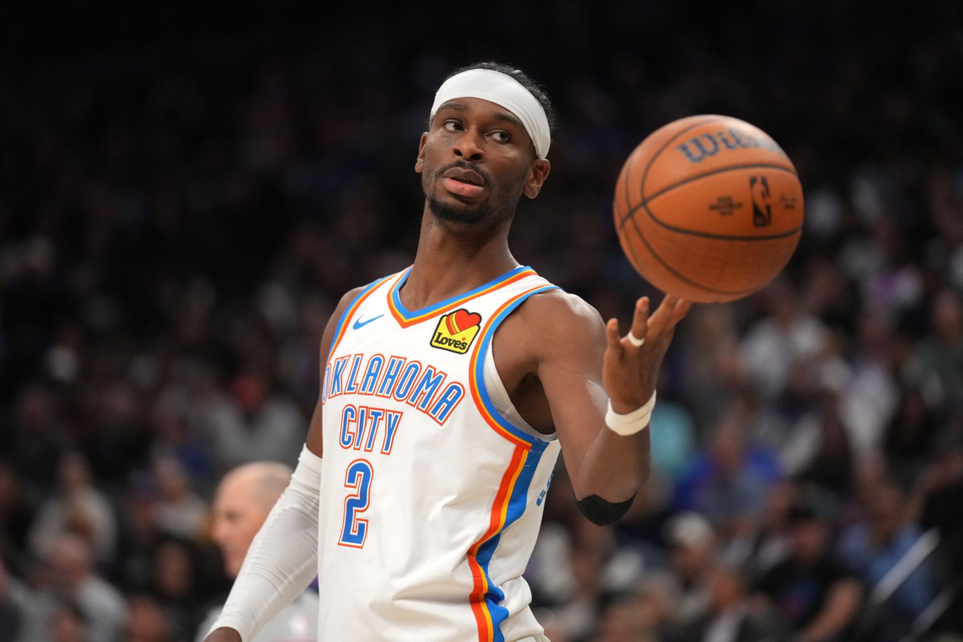 Oklahoma City Thunder guard Shai Gilgeous-Alexander (2) flips the ball to an official after a play against the Sacramento Kings in the second quarter at the Golden 1 Center.