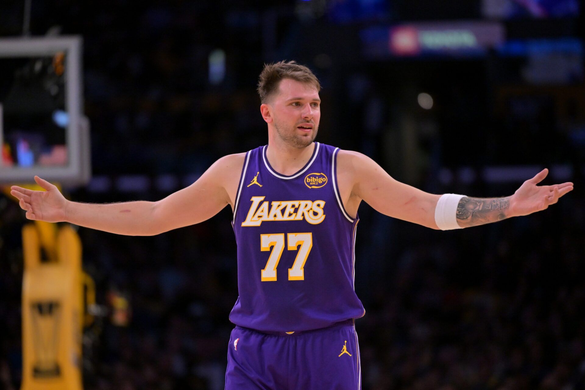 Los Angeles Lakers guard Luka Doncic (77) reacts after a foul on Dallas Mavericks forward Naji Marshall (13) in the second half at Crypto.com Arena.
