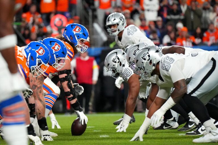 The Denver Broncos offense line up against the Las Vegas Raiders defense during the first half at Empower Field at Mile High.