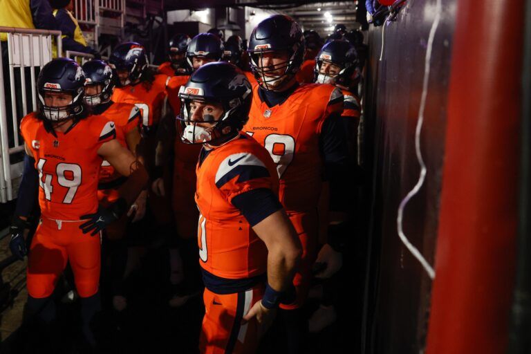 Denver Broncos quarterback Bo Nix (10) waits in the tunnel with teammates before the game against the Washington Commanders at Northwest Stadium.
