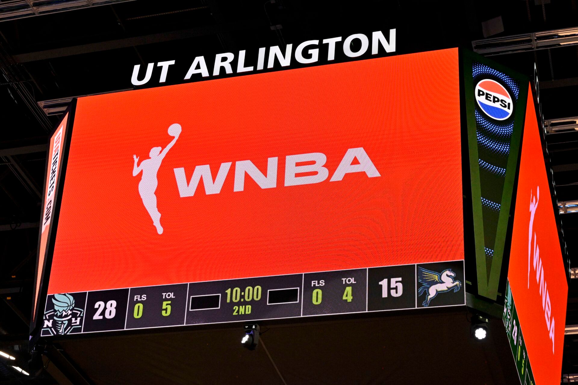 A view of the scoreboard and the WNBA logo as an announcement is made about throwing any toys or objects on to the court during the first half of the game between the Dallas Wings and the New York Liberty at College Park Center.