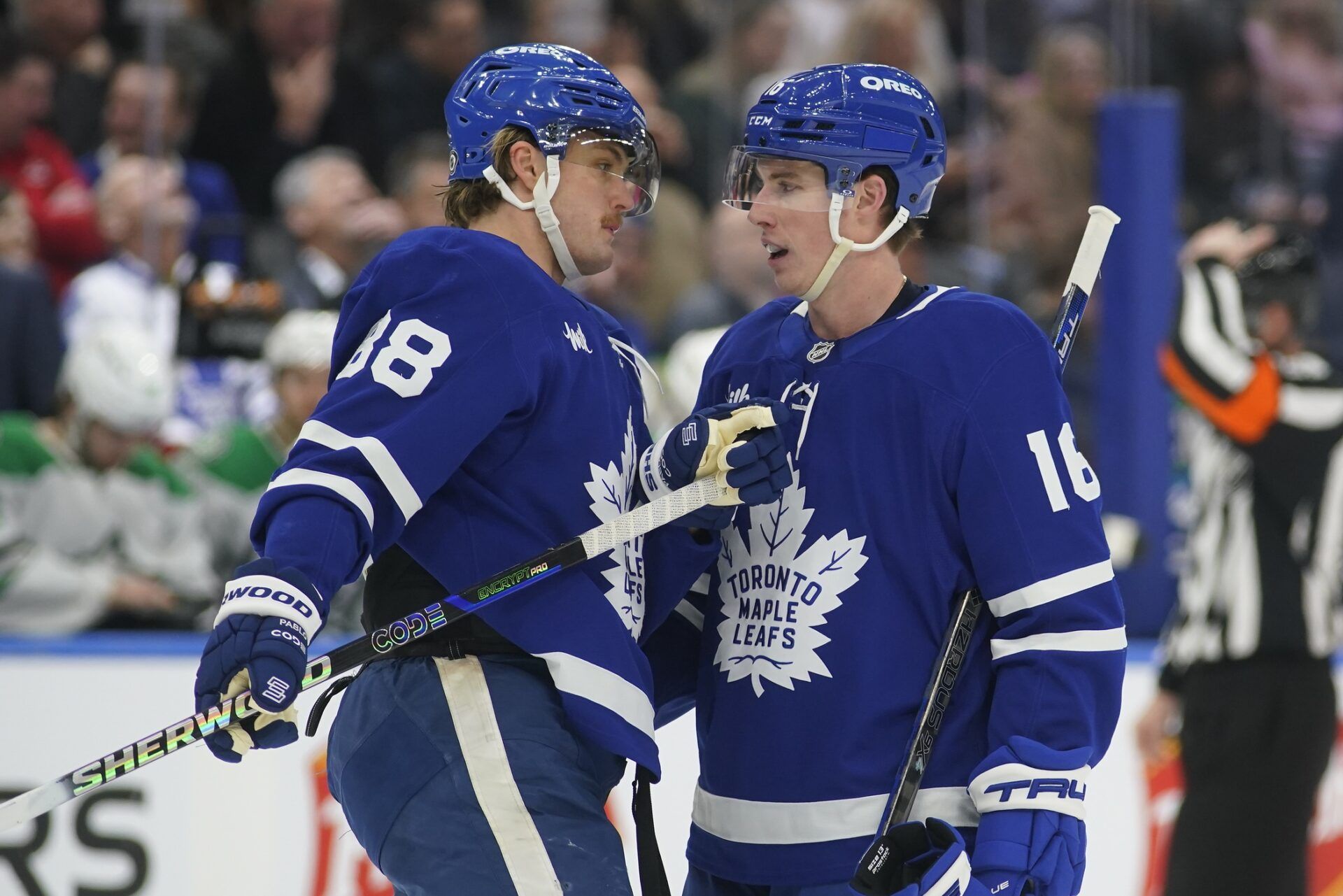 Toronto Maple Leafs forward William Nylander (88) and forward Mitch Marner (16) talk during a break in the action against the Dallas Stars during the third period at Scotiabank Arena.