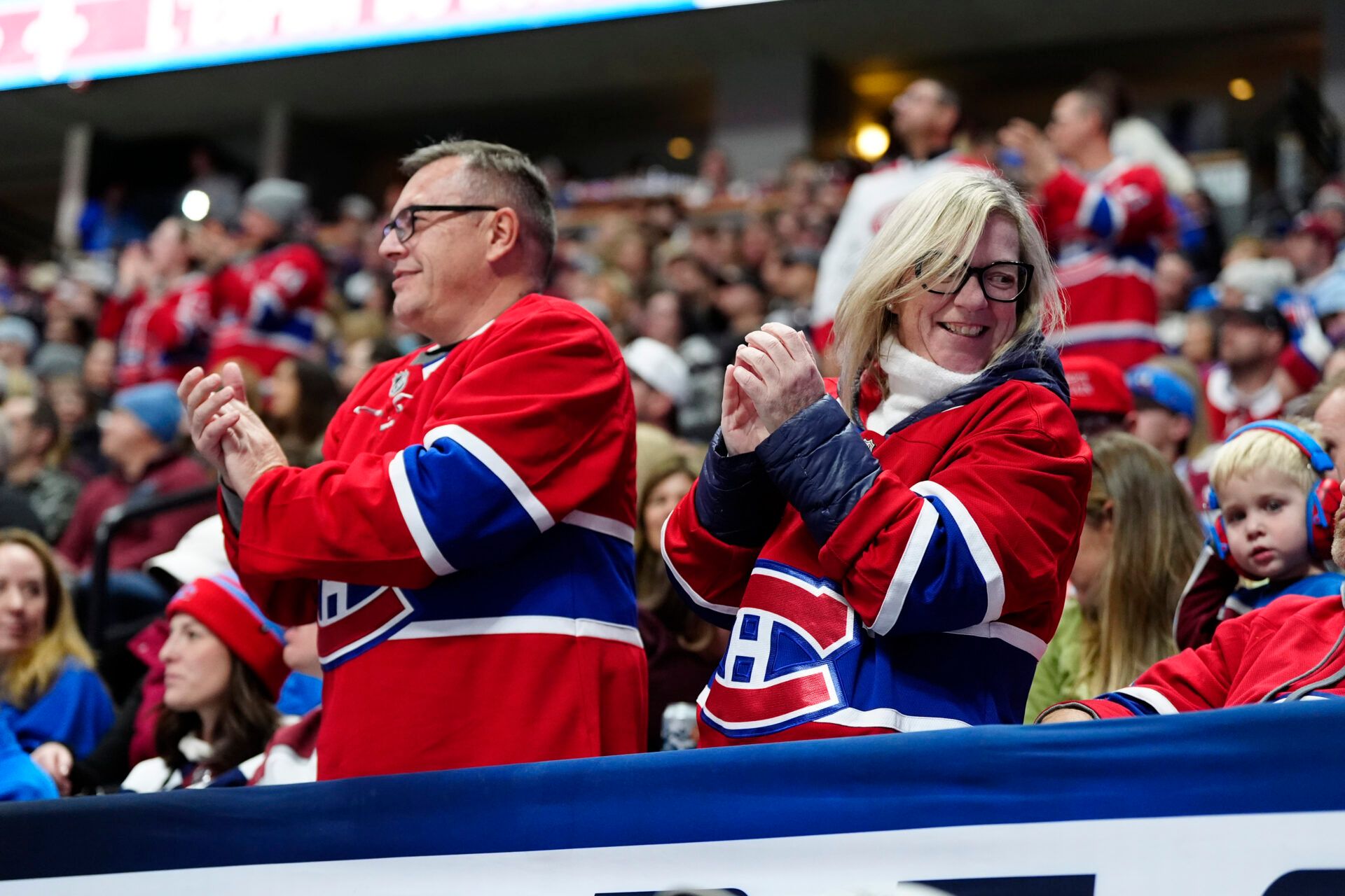 Montreal Canadiens fans celebrate a goal scored in the third period against the Montreal Canadiens at Ball Arena.