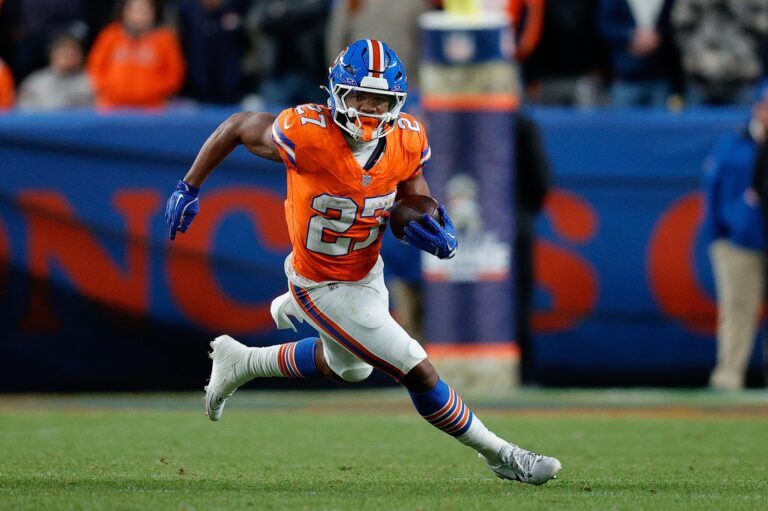 Denver Broncos running back J.K. Dobbins (27) runs the ball in the fourth quarter against the Las Vegas Raiders at Empower Field at Mile High.