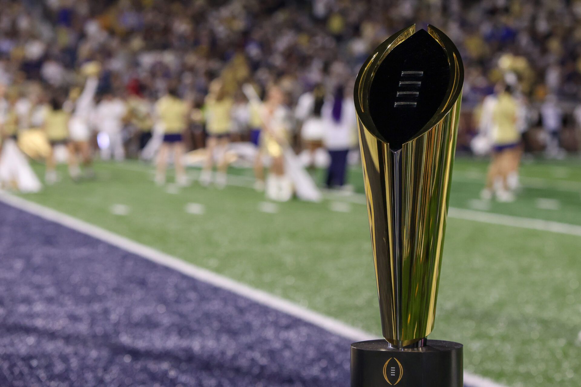 A view of the college football playoff national championship trophy on the sidelines of a game between the Georgia Tech Yellow Jackets and Pittsburgh Panthers in the first quarter at Bobby Dodd Stadium at Hyundai Field.