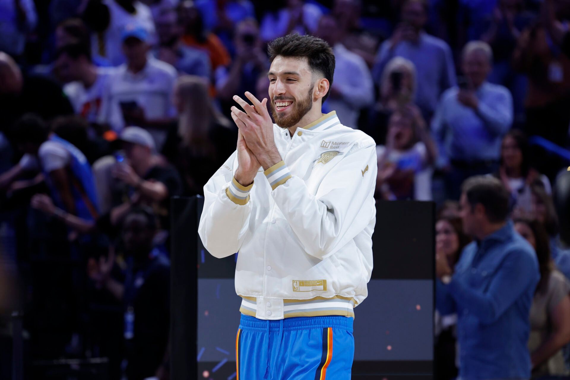 Oklahoma City Thunder center Chet Holmgren walks onto the court to receive his championship ring during the ring ceremony at Paycom Center.