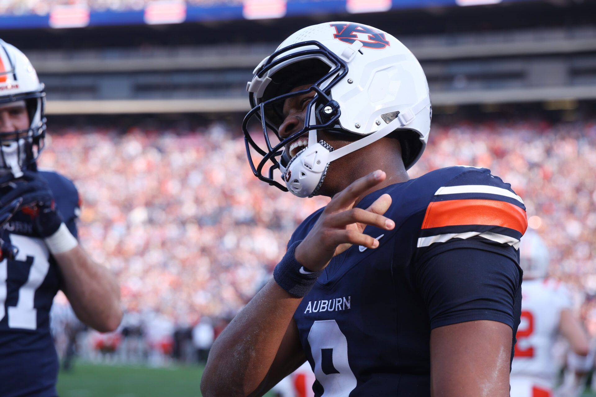 Auburn Tigers quarterback Deuce Knight (9) celebrates after scoring a touchdown during the second quarter against the Mercer Bears at Jordan-Hare Stadium.