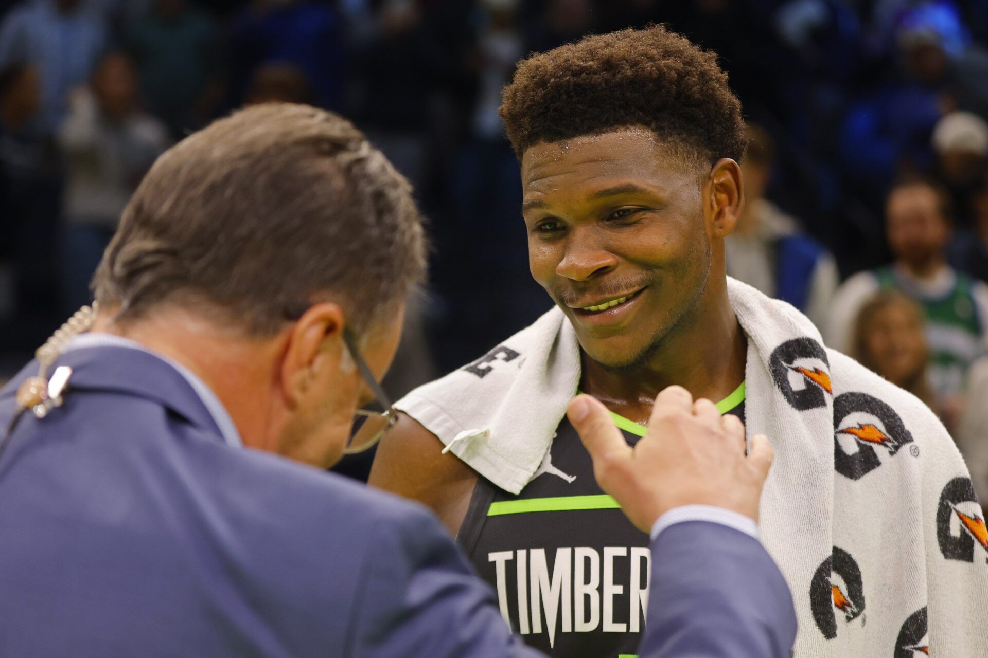 Minnesota Timberwolves guard Anthony Edwards (5) talks with a reporter after defeating the Sacramento Kings at Target Center.