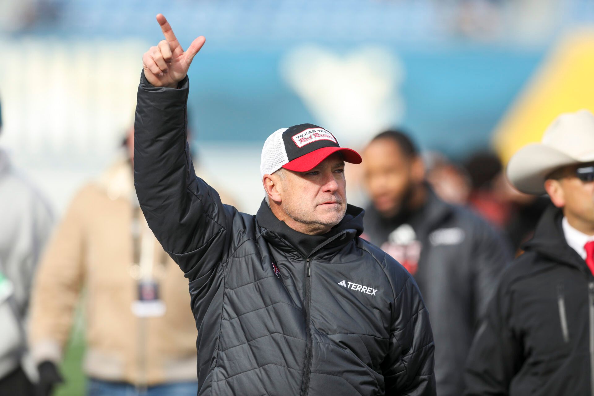 Texas Tech Red Raiders head coach Joey McGuire says hello to fans during the pregame against the West Virginia Mountaineers at Milan Puskar Stadium.