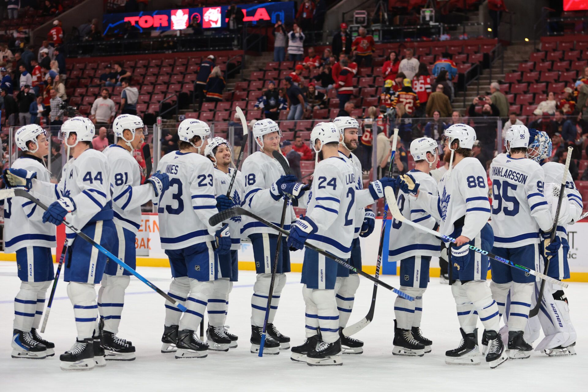 Toronto Maple Leafs players celebrate after the game against the Florida Panthers at Amerant Bank Arena.