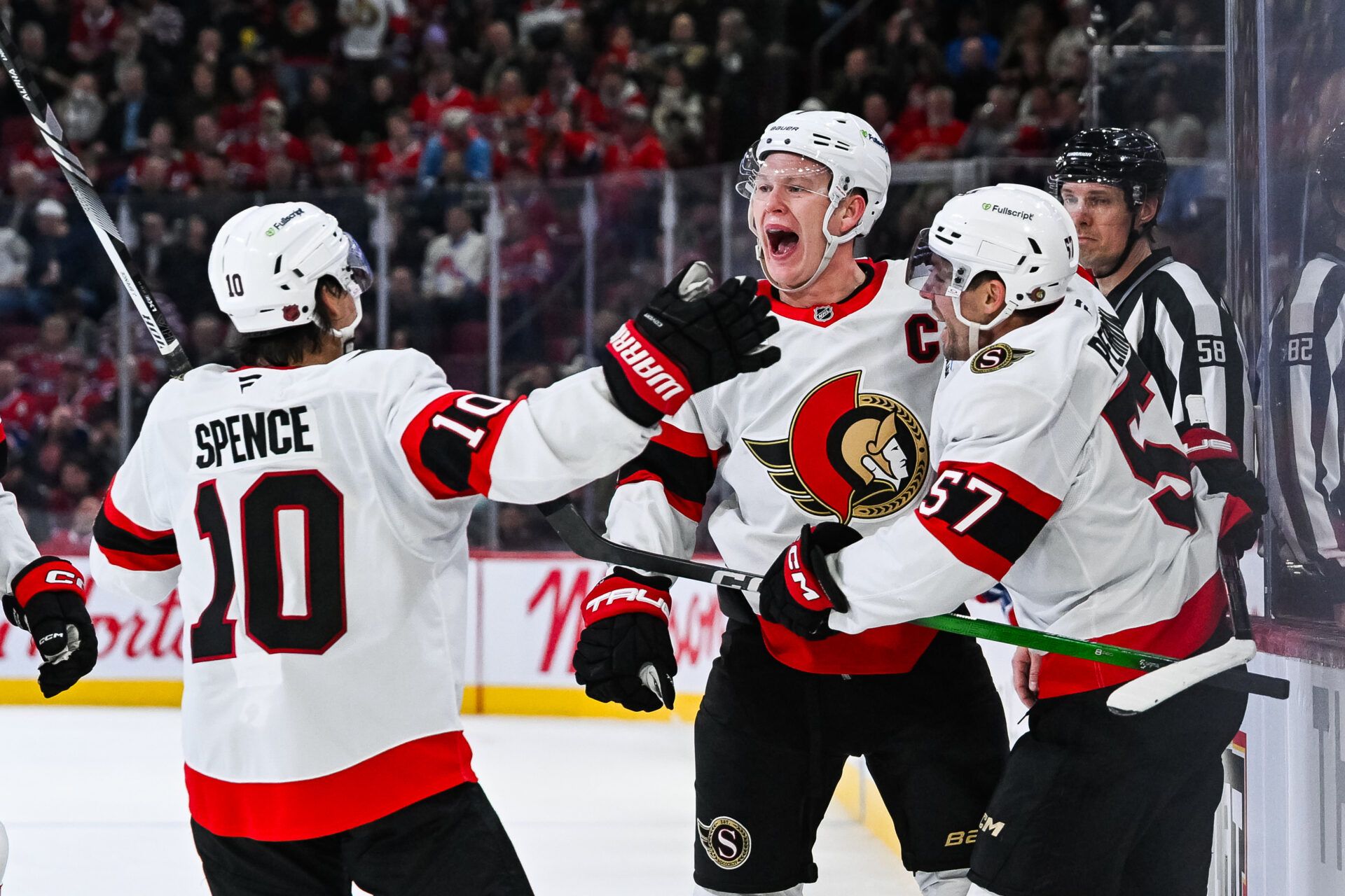 Ottawa Senators left wing Brady Tkachuk (7) celebrates with his teammates his goal against the Montreal Canadiens during the third period at Bell Centre.