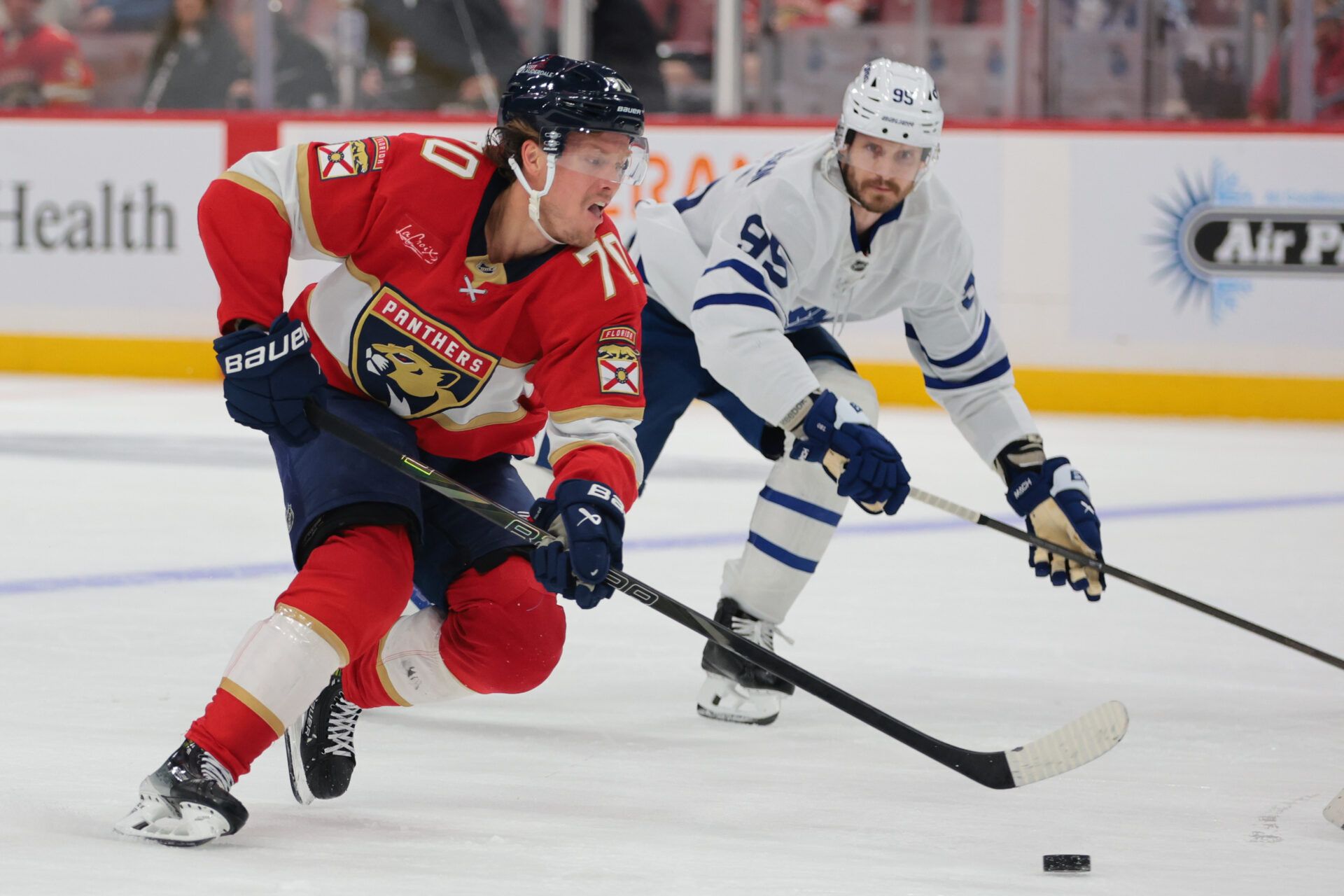 Florida Panthers center Jesper Boqvist (70) moves the puck against Toronto Maple Leafs defenseman Oliver Ekman-Larsson (95) during the third period at Amerant Bank Arena.