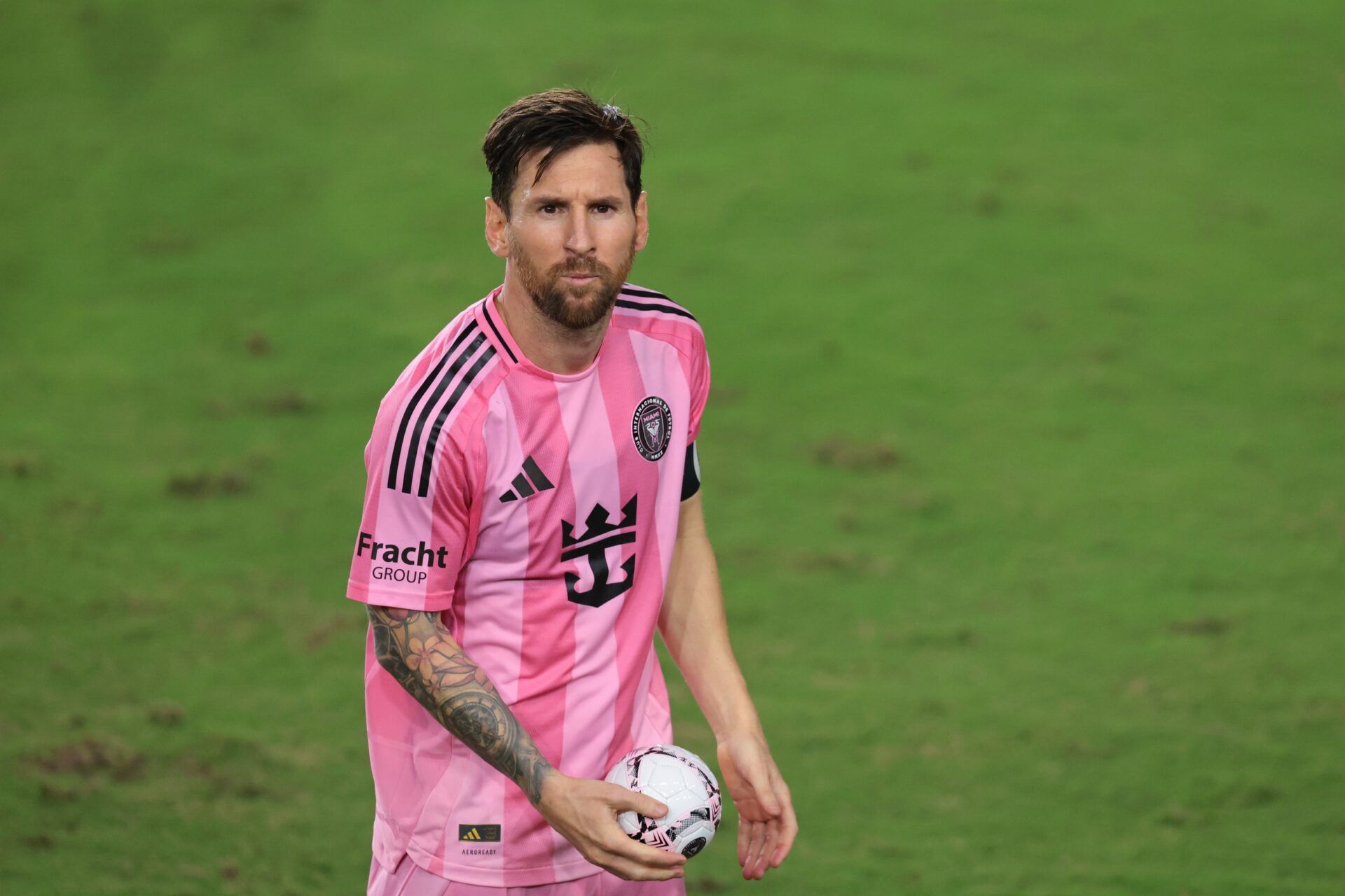 Inter Miami CF forward Lionel Messi (10) kicks a small soccer ball for the fans after the game against Atlanta United at Chase Stadium.