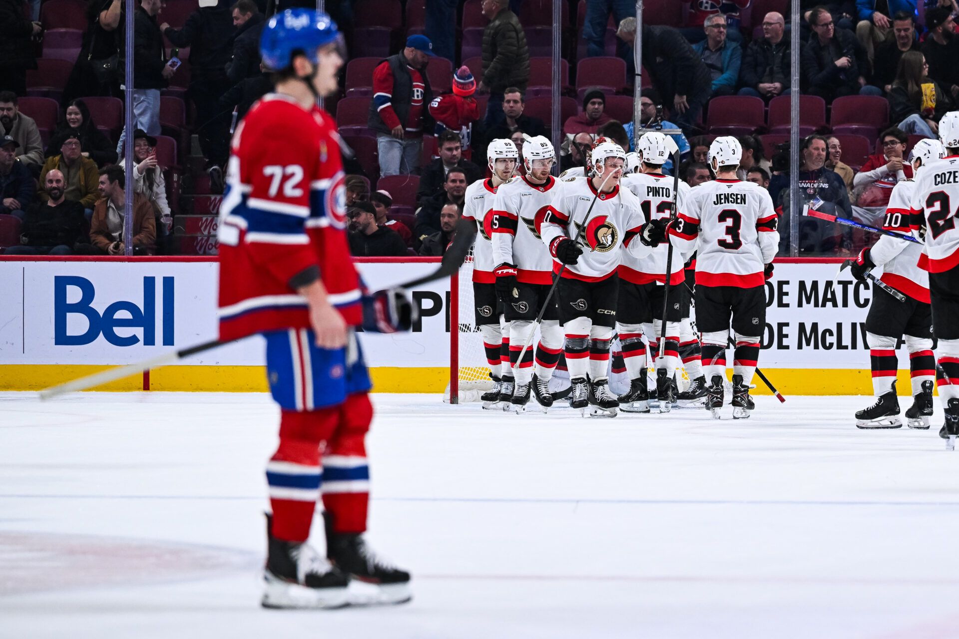 Ottawa Senators players gather together to celebrate their win against the Montreal Canadiens after the end of the game at Bell Centre.