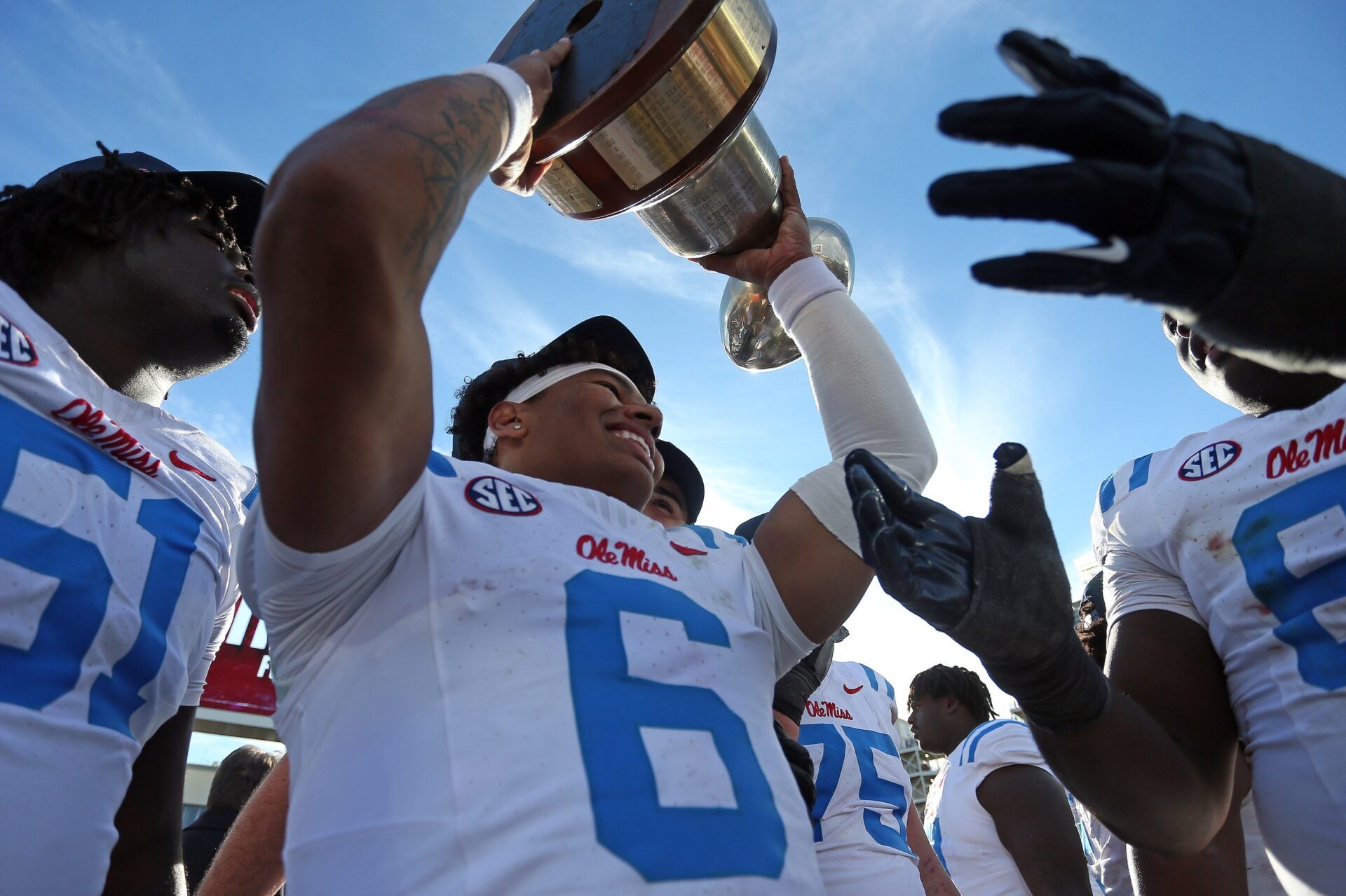 Mississippi Rebels quarterback Trinidad Chambliss (6) holds the Golden Egg trophy after defeating the Mississippi State Bulldogs at Davis Wade Stadium at Scott Field.