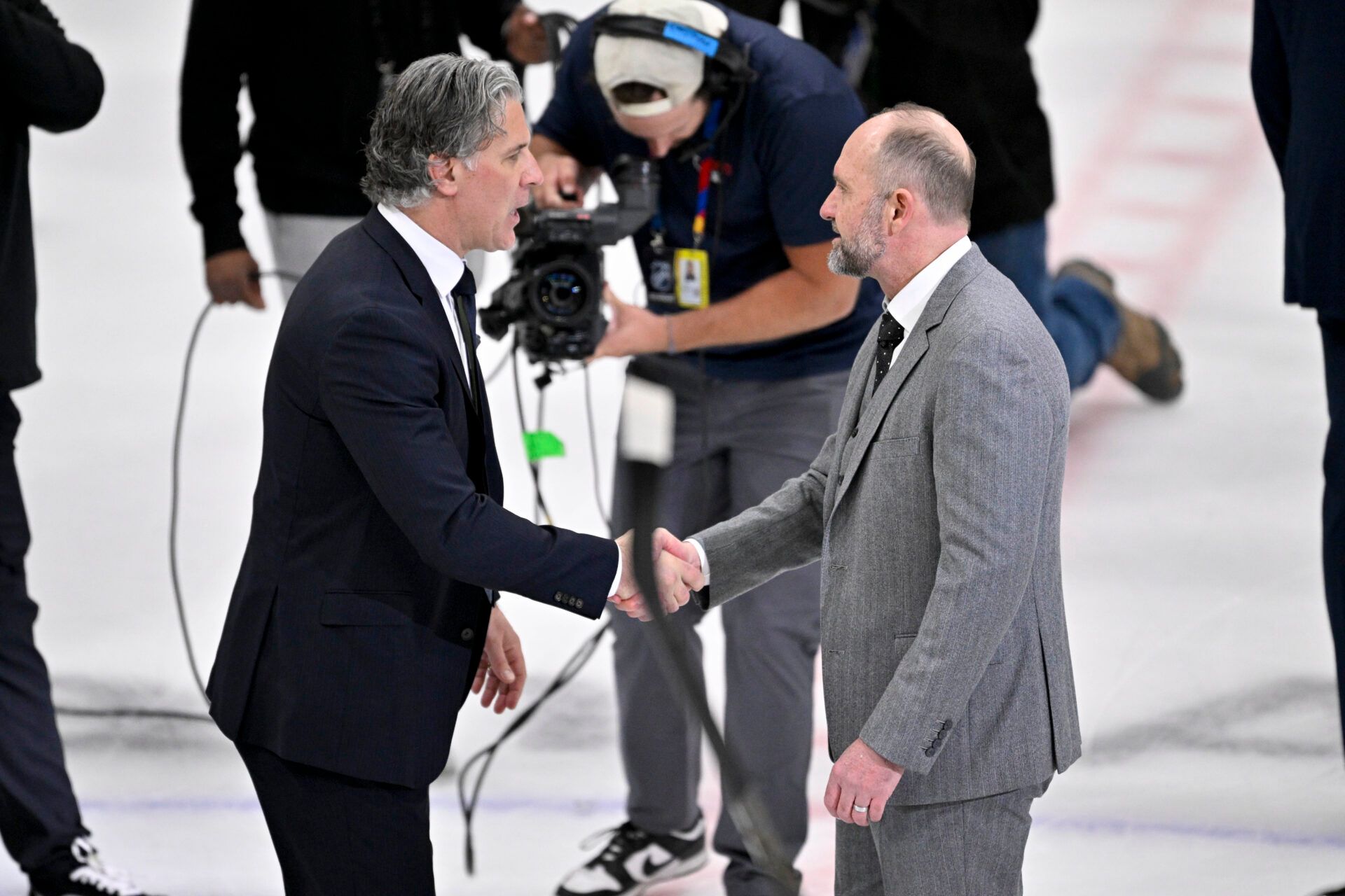 Colorado Avalanche head coach Jared Bednar shakes hands with Dallas Stars head coach Peter DeBoer after the Stars defeats the Avalanche in game seven of the first round of the 2025 Stanley Cup Playoffs at American Airlines Center.