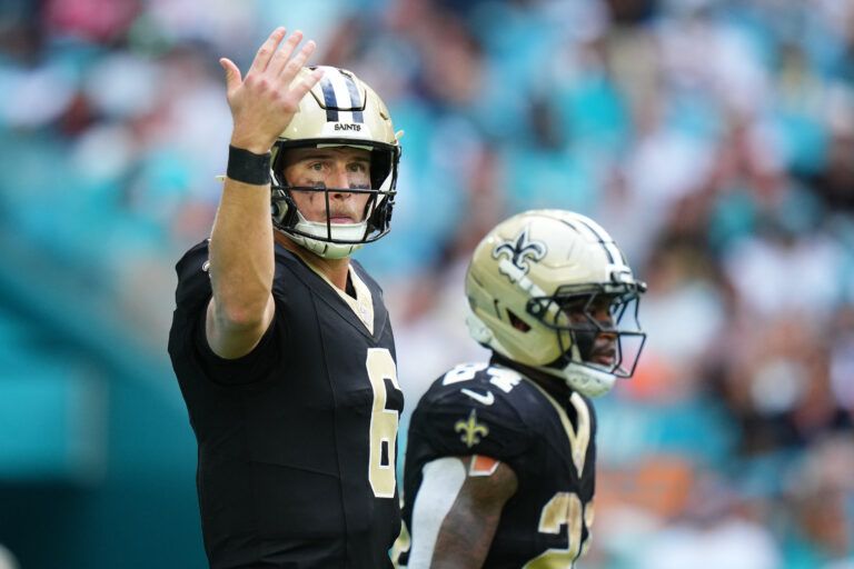New Orleans Saints quarterback Tyler Shough (6) gestures at the line of scrimmage against the Miami Dolphins during the second half at Hard Rock Stadium.
