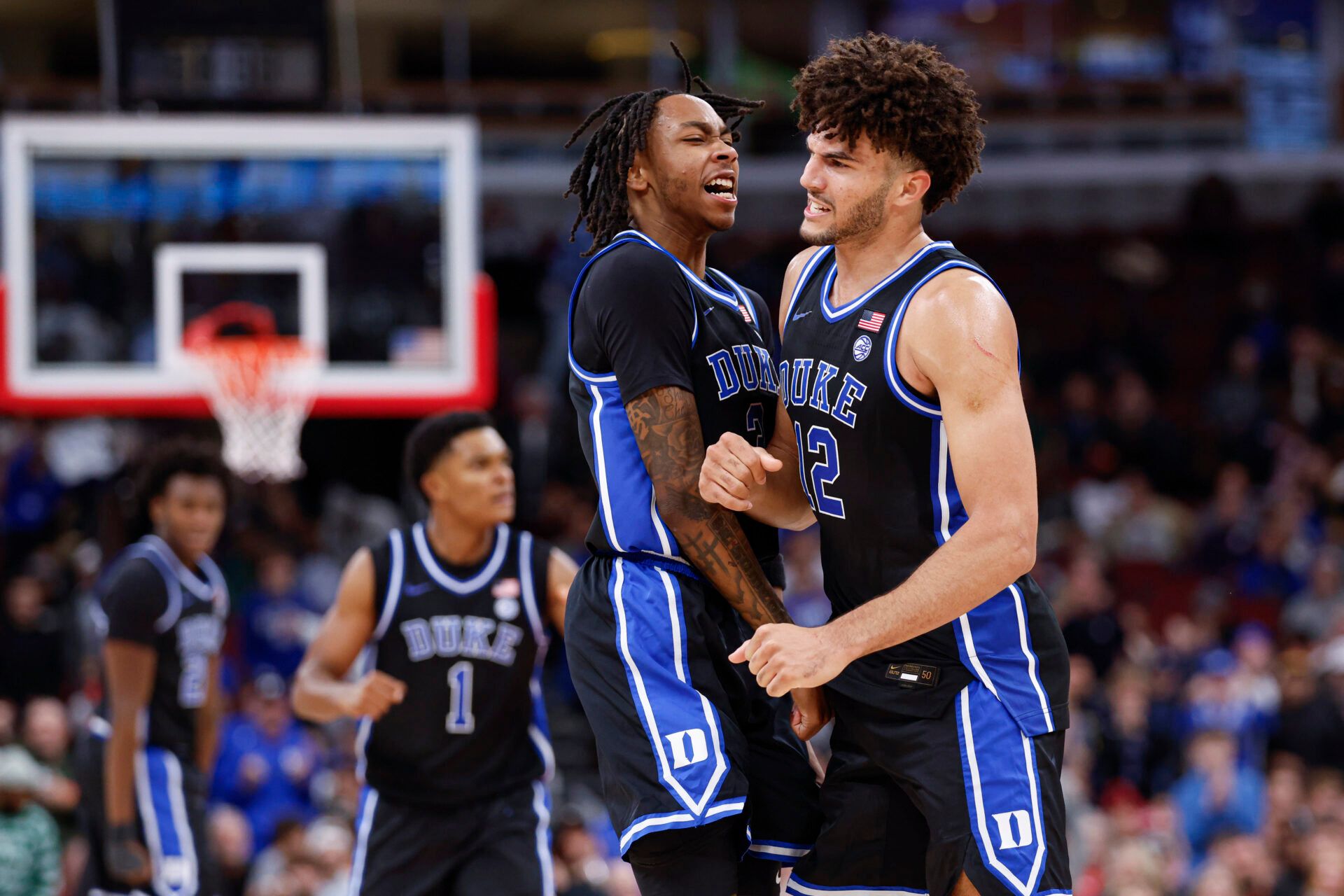 Duke Blue Devils forward Cameron Boozer (12) celebrates with guard Isaiah Evans (3) during the second half at United Center.