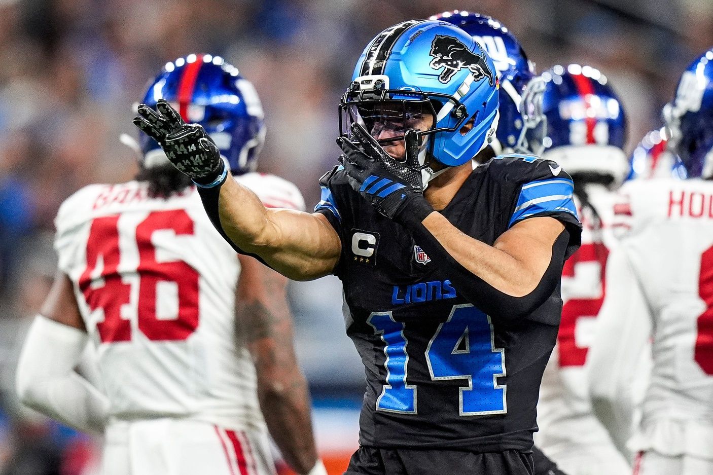 Detroit Lions wide receiver Amon-Ra St. Brown (14) celebrates a first down against New York Giants during the first half at Ford Field in Detroit on Sunday, Nov. 23, 2025.
