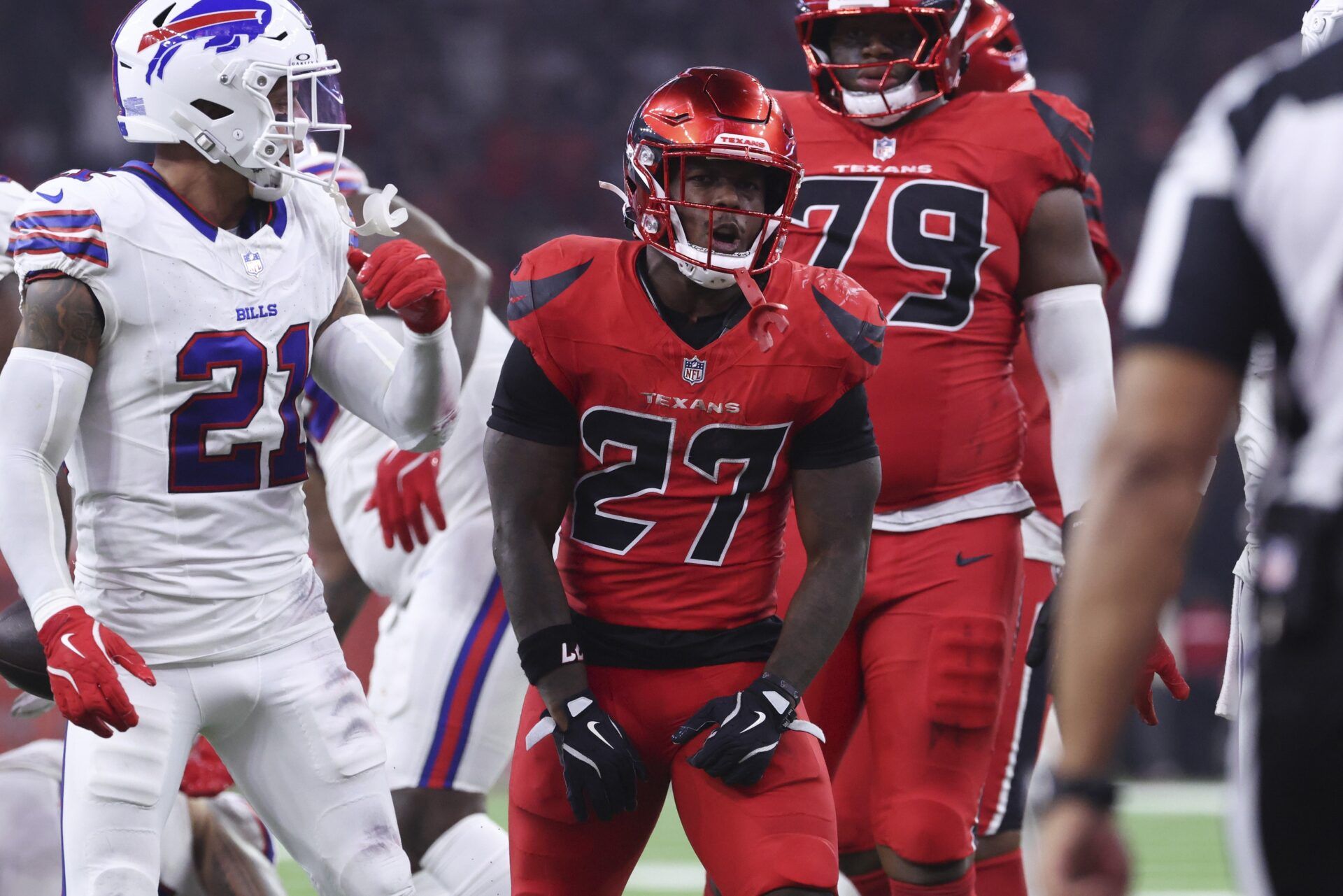 Houston Texans running back Woody Marks (27) reacts after running for a first down during the game against the Buffalo Bills at NRG Stadium.