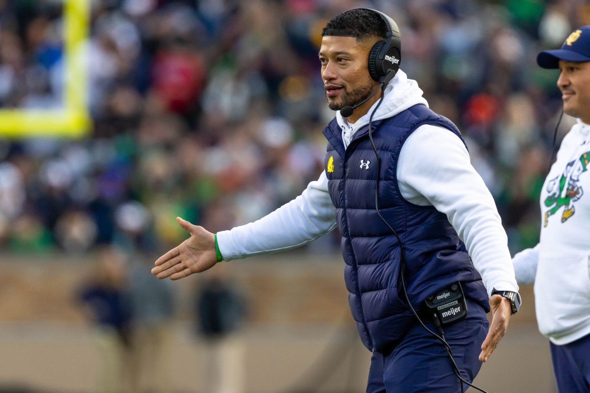 Notre Dame Fighting Irish head coach Marcus Freeman celebrates with players after scoring against the Syracuse Orange during the first half at Notre Dame Stadium.