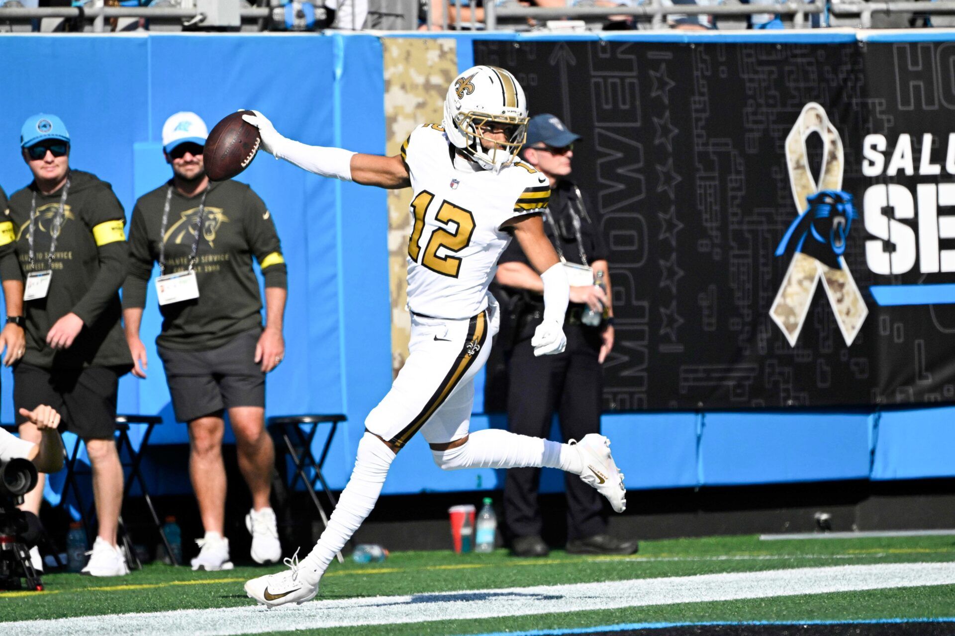 New Orleans Saints wide receiver Chris Olave (12) scores a touchdown during the second quarter against the Carolina Panthers at Bank of America Stadium.