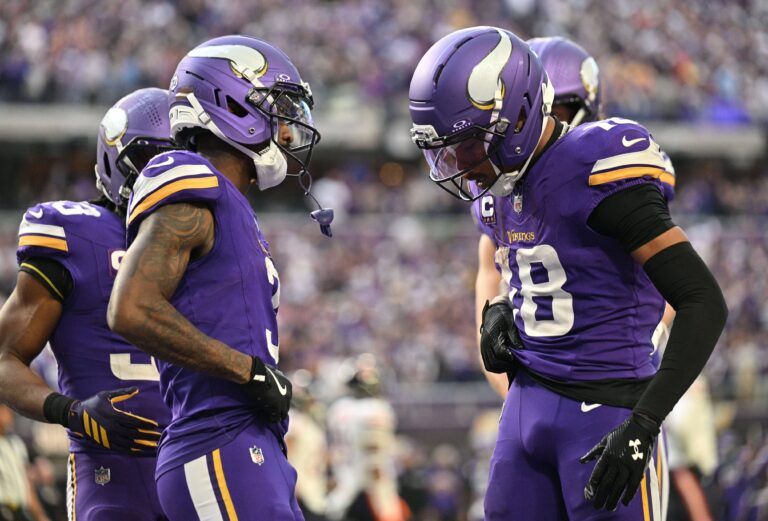 Minnesota Vikings wide receiver Jordan Addison (3) and wide receiver Justin Jefferson (18) celebrate a touchdown during the fourth quarter against the Chicago Bears at U.S. Bank Stadium.