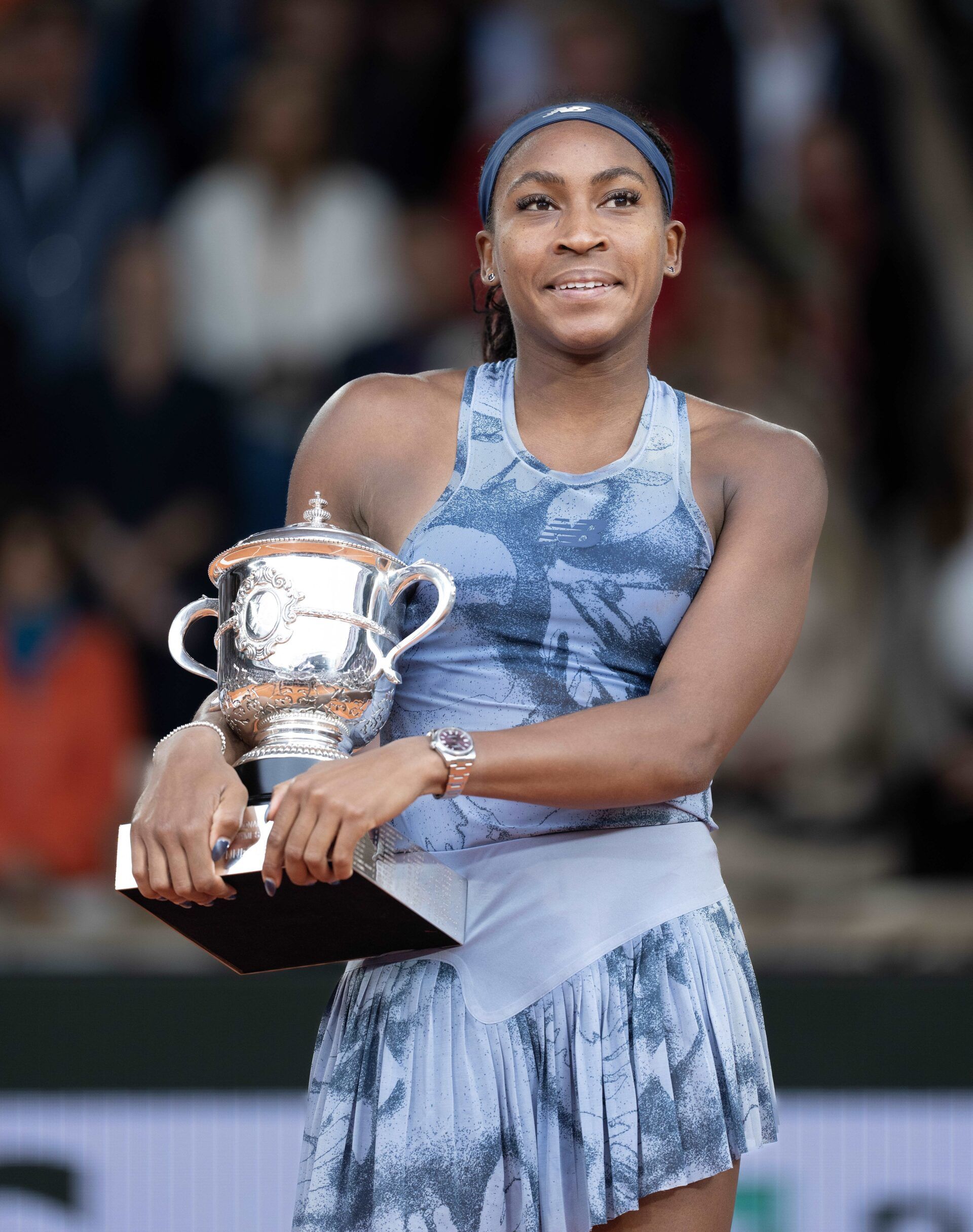 Coco Gauff of the United States poses with the trophy after winning the womens singles final against Aryna Sabalenka on day 14 at Roland Garros Stadium.