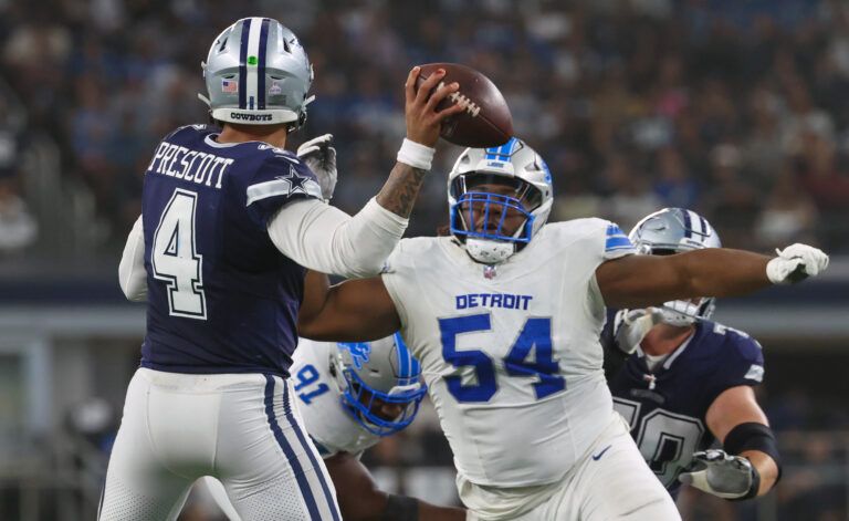 Detroit Lions defensive tackle Alim McNeill (54) rushes Dallas Cowboys quarterback Dak Prescott (4) during the second half at AT&T Stadium.