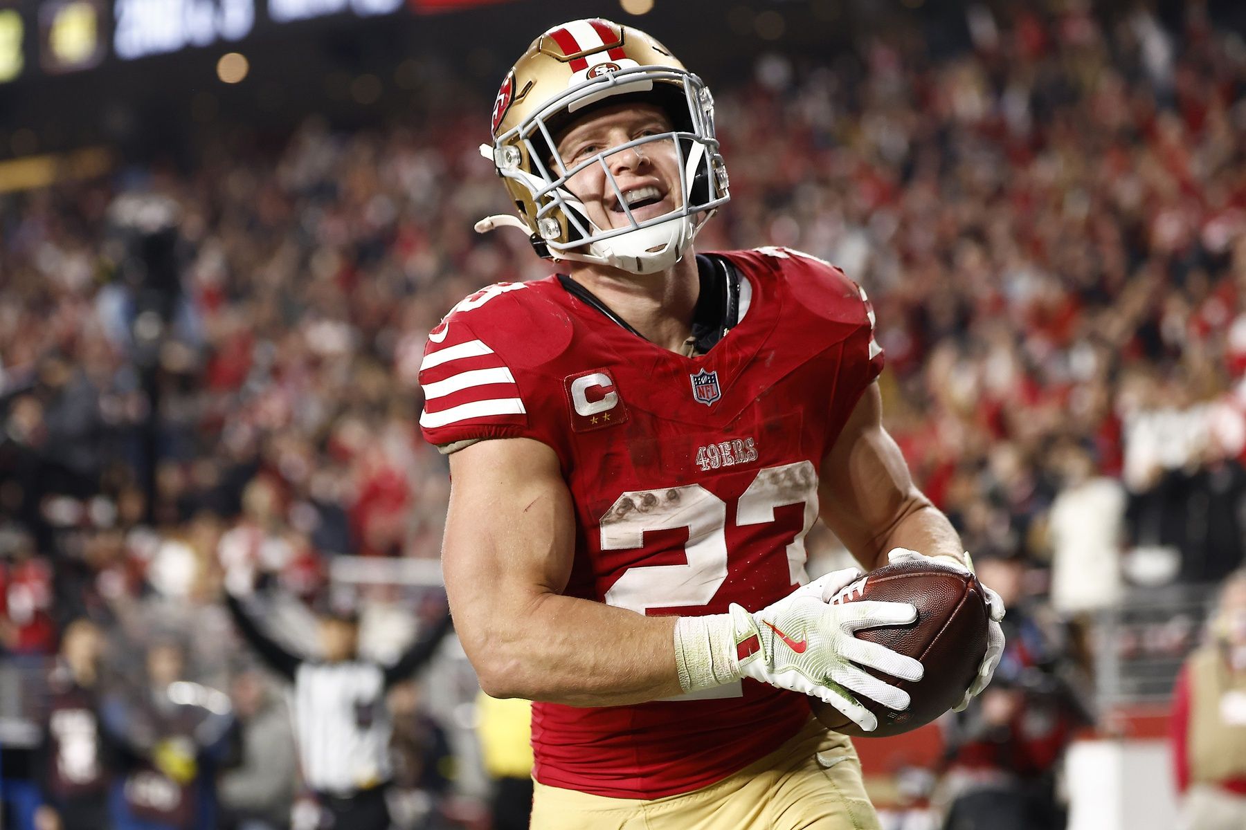 San Francisco 49ers running back Christian McCaffrey (23) reacts after scoring a touchdown against the Carolina Panthers during the second half at Levi's Stadium.