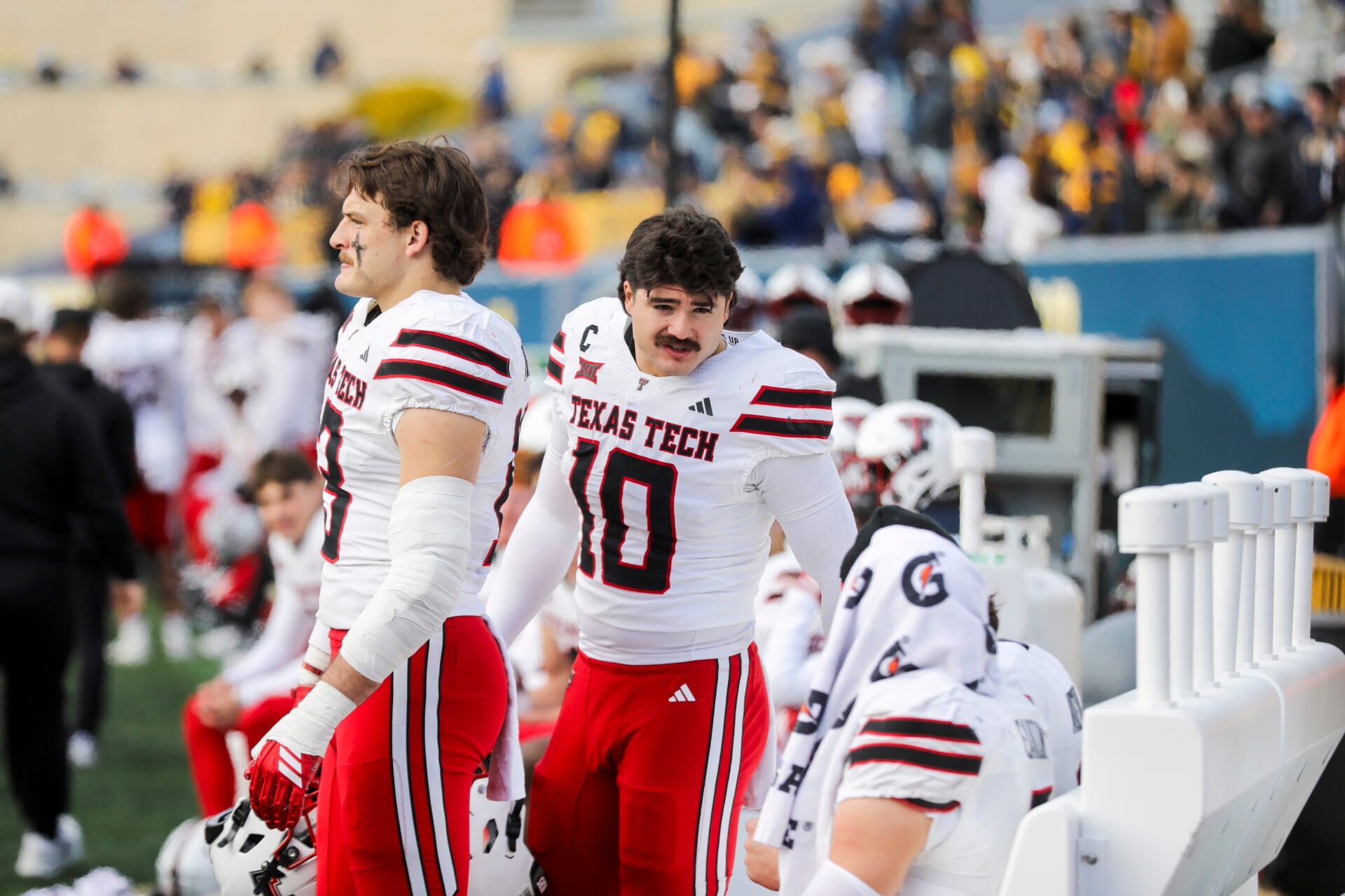 Texas Tech Red Raiders linebacker Jacob Rodriguez (10) talks with Texas Tech Red Raiders quarterback Behren Morton (2) and Texas Tech Red Raiders wide receiver Coy Eakin (3) during the fourth quarter against the West Virginia Mountaineers at Milan Puskar Stadium.