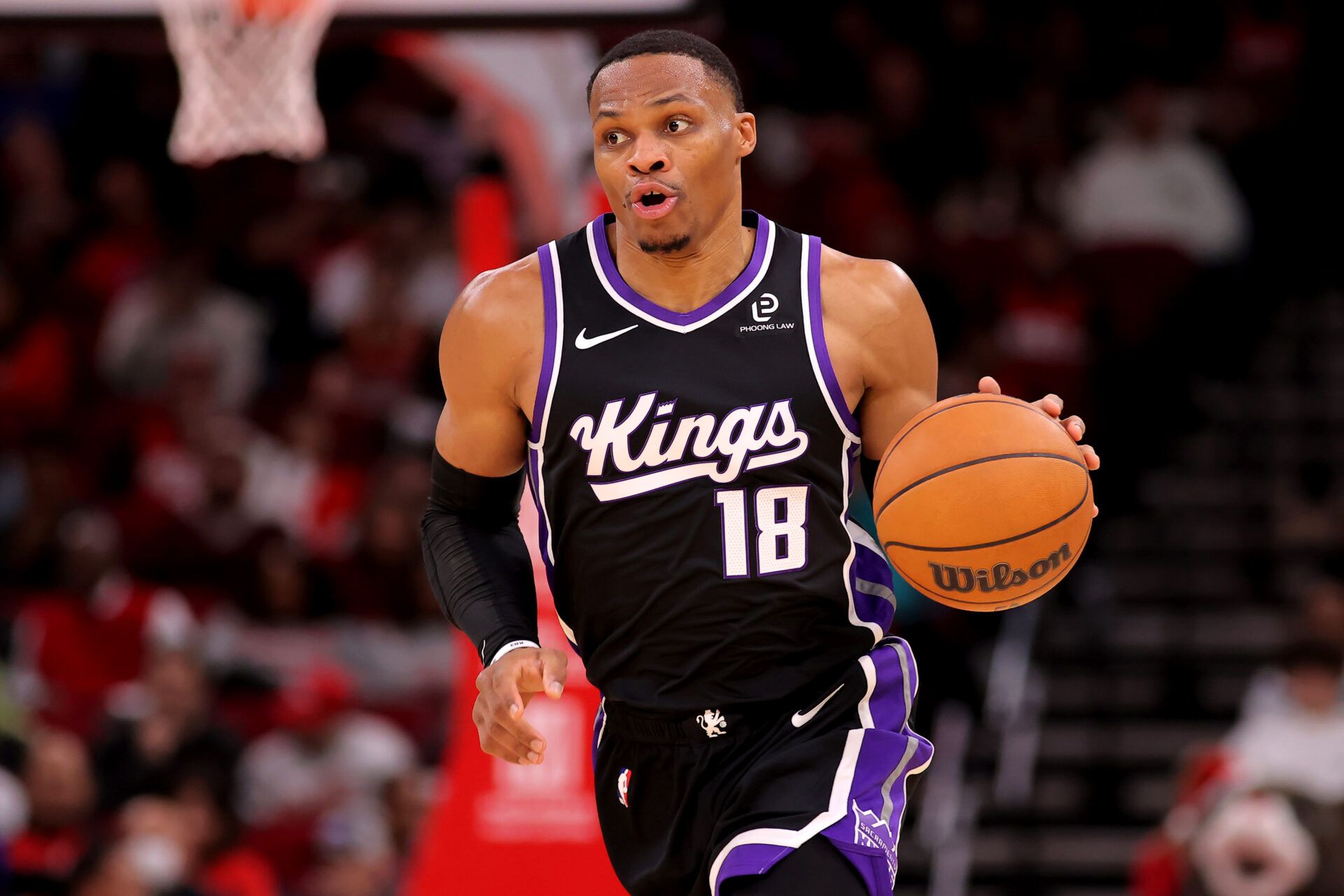 Sacramento Kings guard Russell Westbrook (18) handles the ball against the Houston Rockets during the third quarter at Toyota Center.