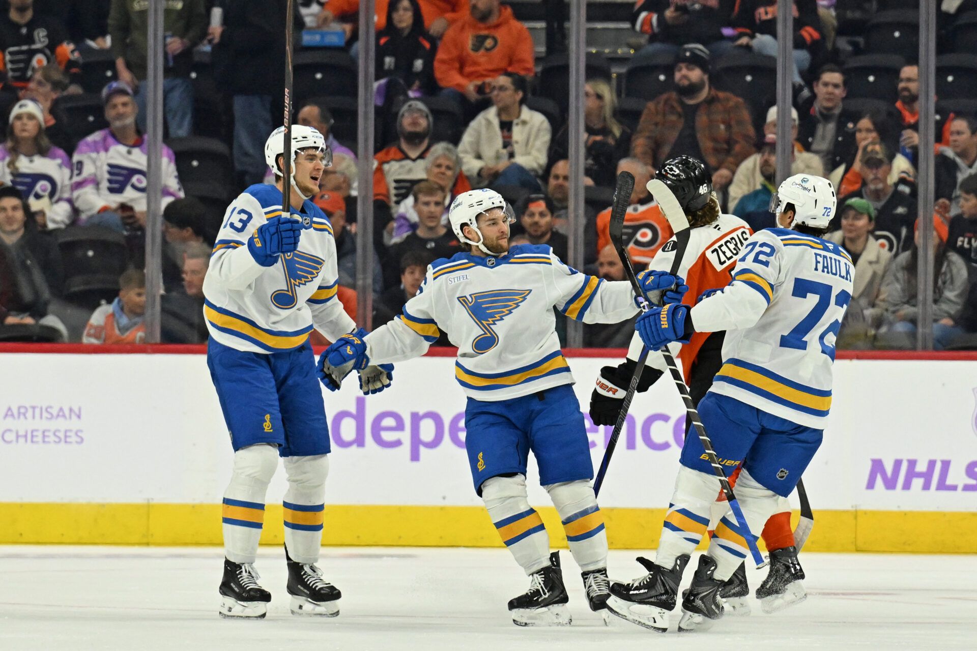 St. Louis Blues defenseman Justin Faulk (72) celebrates his goal with right wing Alexey Toropchenko (13) and left wing Nathan Walker (26)  against the Philadelphia Flyers  during the first period at Xfinity Mobile Arena.